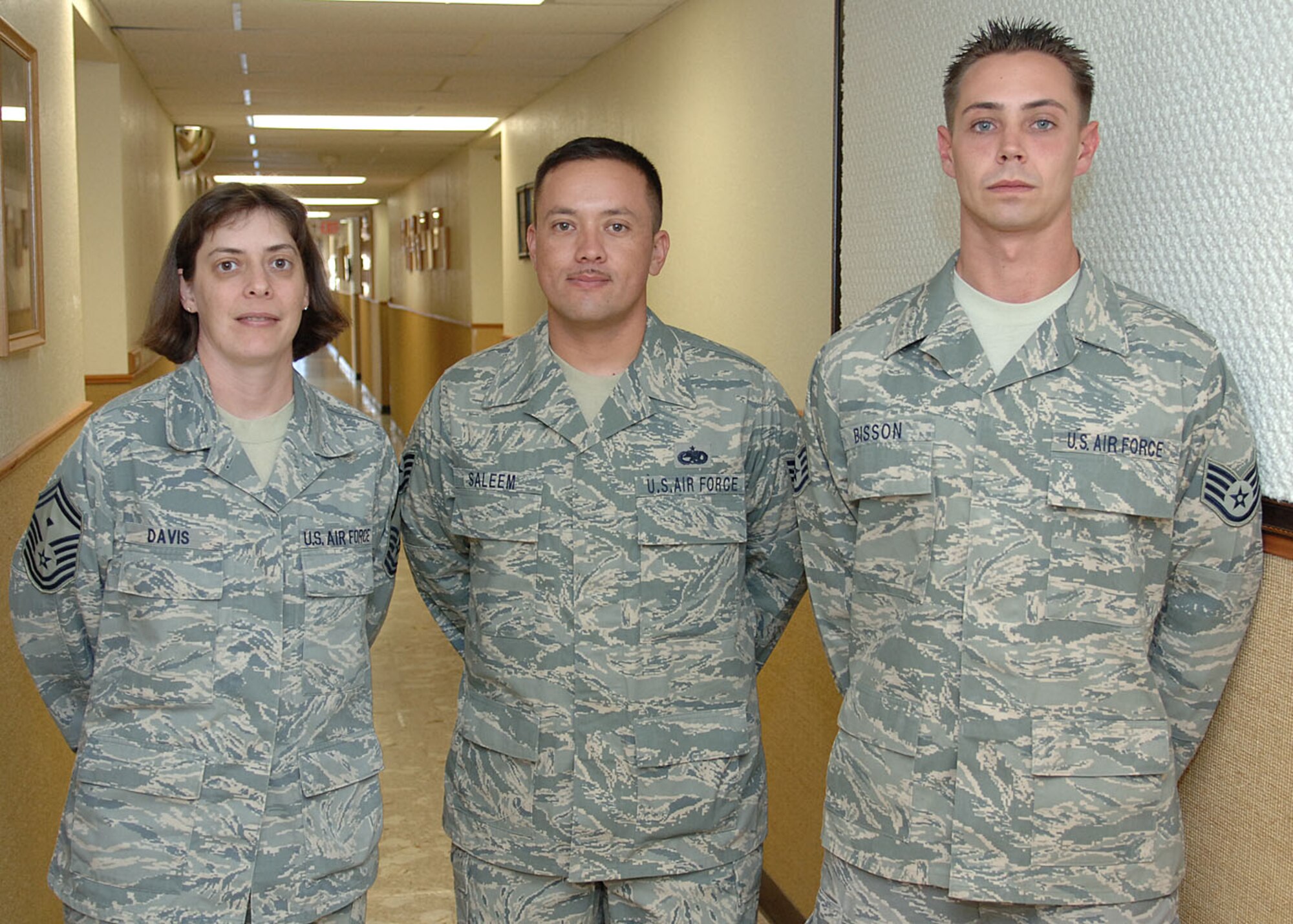 Senior Master Sgt. Grace Davis, 49th Maintenance Squadron, poses with her returned deployed members, Staff Sgt.'s Mitch Bisson and Mohammad Saleem, 49th Maintenance Squadron September 23, at Holloman Air Force Base, N.M.  SSgt. Bisson was deployed to Qayyarah West, Iraq and SSgt. Saleem was deployed to Al Asad, Iraq.  (U.S. Air Force photo by Airman 1st Class John D. Strong II)