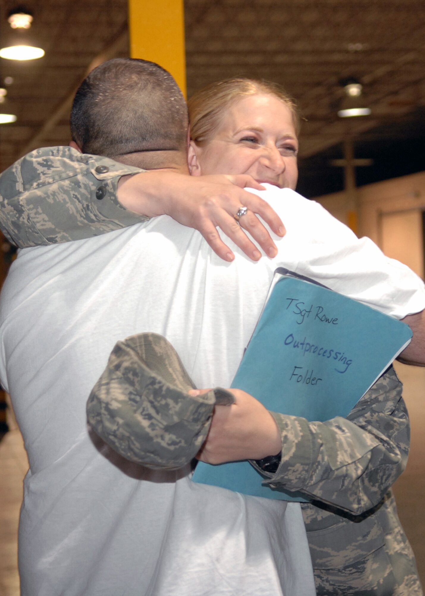 Tech. Sgt. Valerie Rowe, 49th Materiel Maintenance Group, hugs Tech Sgt. Brian Butler, 49th Material Maintenance Support Squadron, upon her arrival to the weapons vault at Holloman Air Force Base, N.M., September 15. Sergeant Rowe just returned home from a six month deployment to Balad Air Base, Iraq. (U.S. Air Force photo/Airman 1st Class Veronica Salgado) 