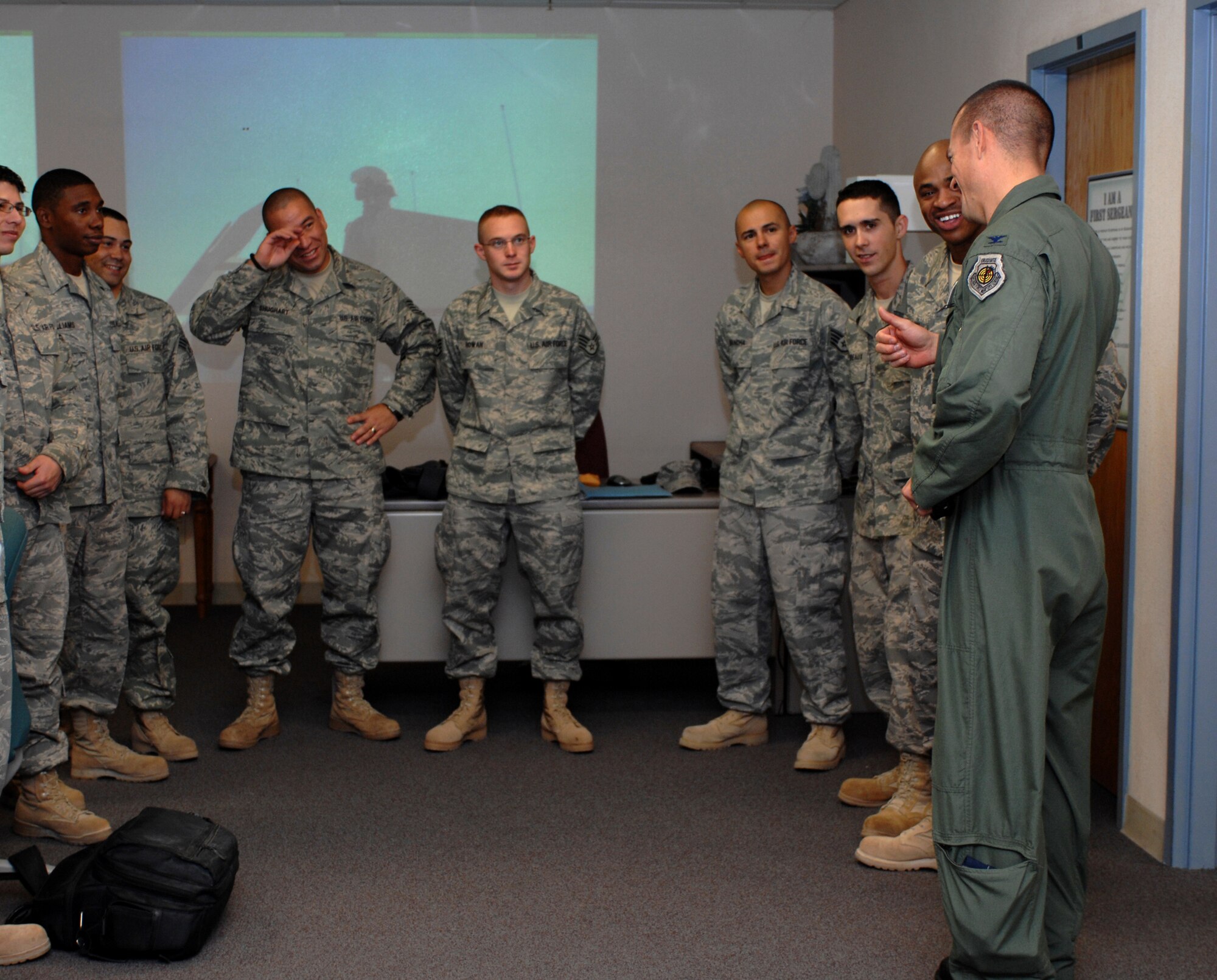Col. Michael McGee, 49th Fighter Wing vice commander, welcomes home the 49th Logistics Readiness Squadron Airmen who just returned home from an eight-month deployment to Kuwait at Holloman Air Force Base, N.M., September 23. One returning warrior, Master Sgt. Curtiss Wilson, said much of what the Airmen did during the deployment was go on combat convoys. (U.S. Air Force photo/Airman Sondra M. Escutia)
