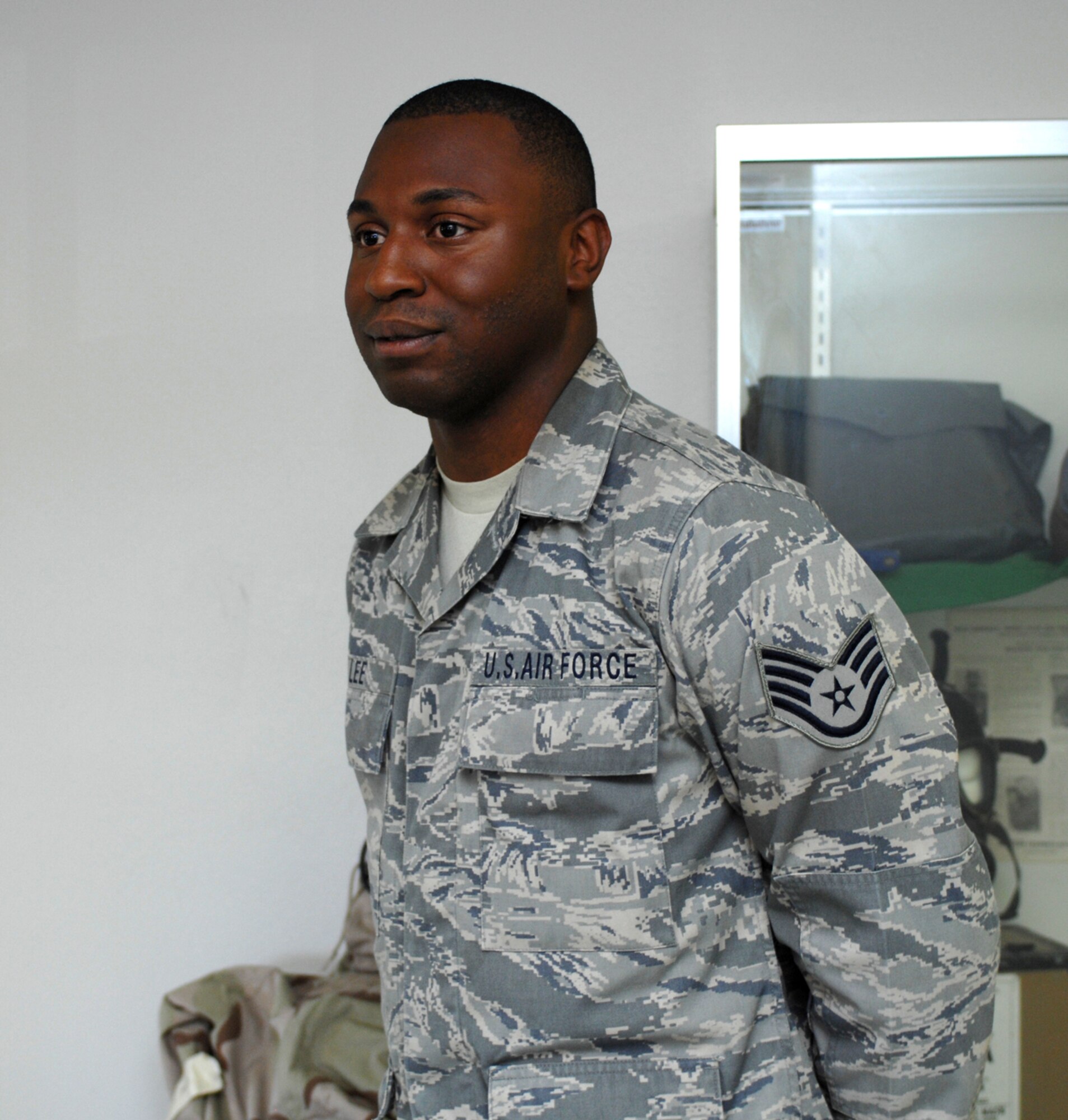 Staff Sgt. Eric Lee, 49th Civil Engineer Squadron, takes a moment to relax with other members of the 49 CES who greeted him upon his return home to Holloman Air Force Base, N.M., September 23 after he returned from a five month deployment to Kirkuk Air Base, Iraq. (U.S. Air Force photo/Airman Sondra M. Escutia)