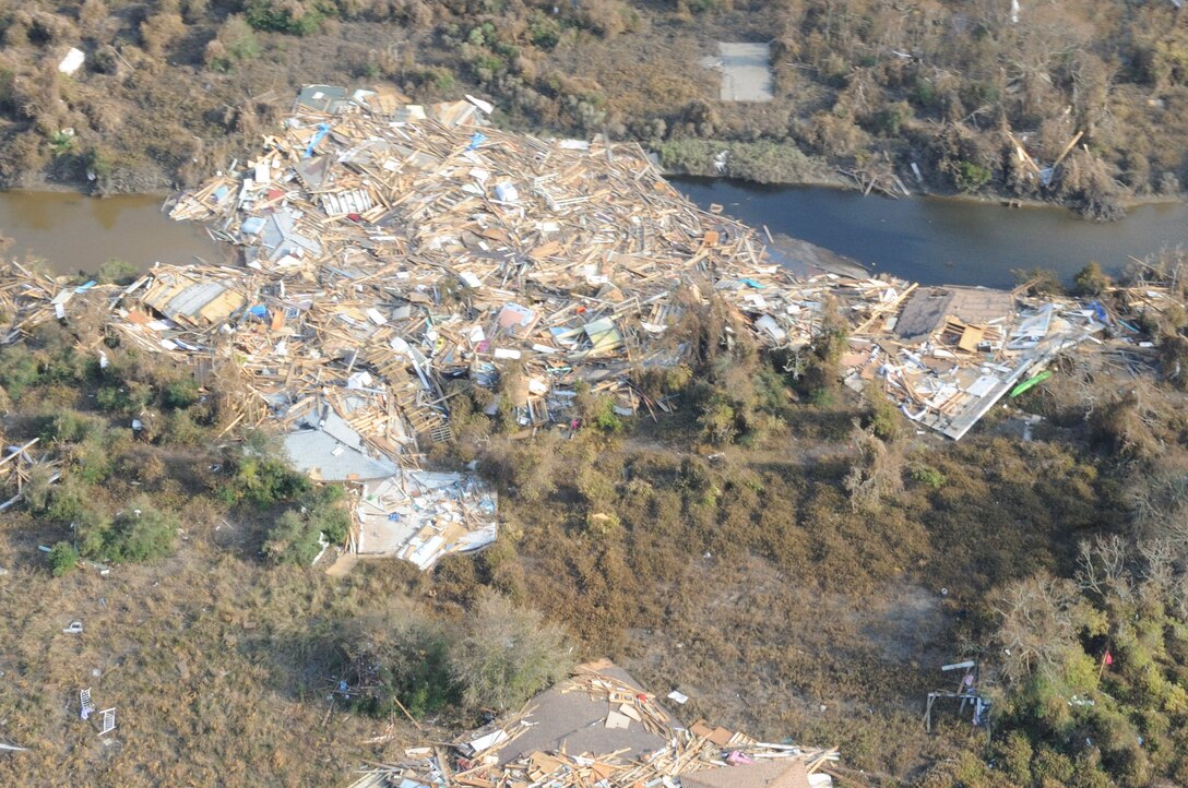 From on board the Army Blackhawk helicopter, the aerial view of Hurricane Ike's devastation is evident on Bolivar Island on the Texas coast. Hurricane Ike made landfall on the Texas coast as a category 2-3. The houses below look like a bunch of match sticks strewn about.  September 19, 2008  (Air Force photo by SMSgt Elizabeth Gilbert) Cleared