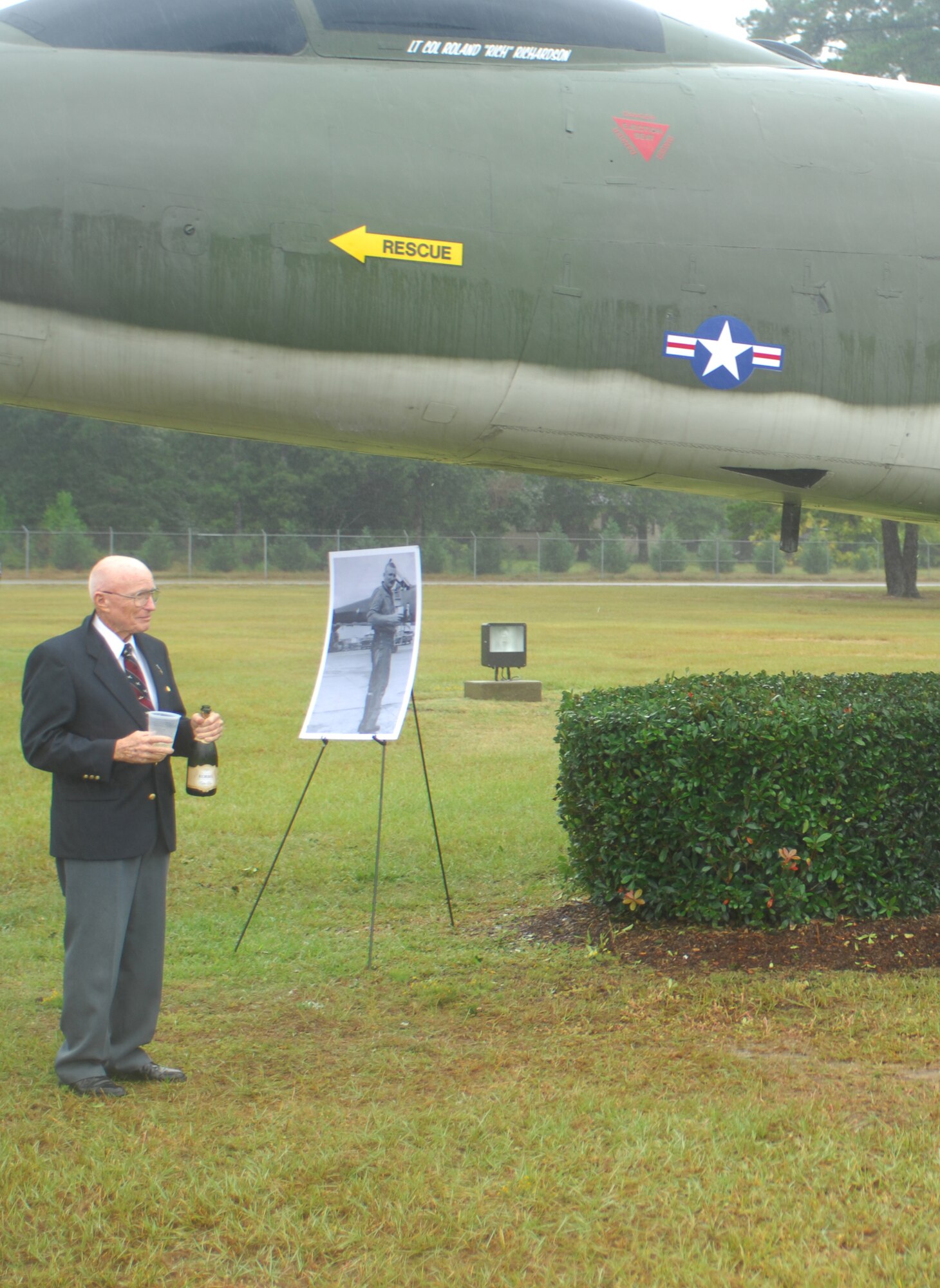 SHAW AIR FORCE BASE, S.C. -- Retired Lt. Col. Roland Richardson stands in front of a static display of an RF-101, which was dedicated in his honor Sept. 26. The last 13 RF-101s departed Shaw Feb. 17, 1971 and Colonel Richardson was last to leave Shaw holding the No. 13 position. (U.S. Air Force photo/Staff Sgt. Patrick Mitchell)