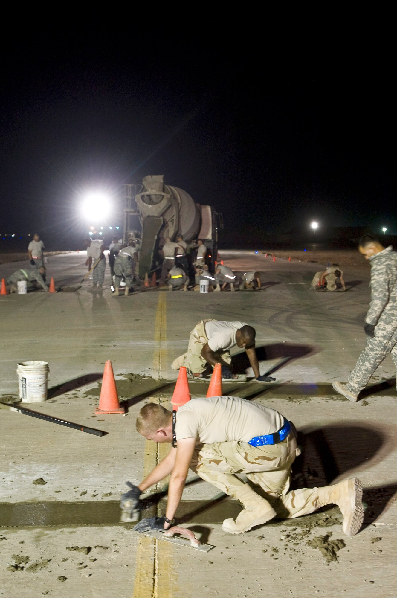Airmen with the 407th Expeditionary Civil Engineer Squadron repair a section of runway Sept. 22 at Ali Base, Iraq. Extreme heat, along with normal wear and tear, can damage portions of the flightline, making it unsafe for aircraft. (U.S. Air Force photo/Airman 1st Class Christopher Griffin) 
