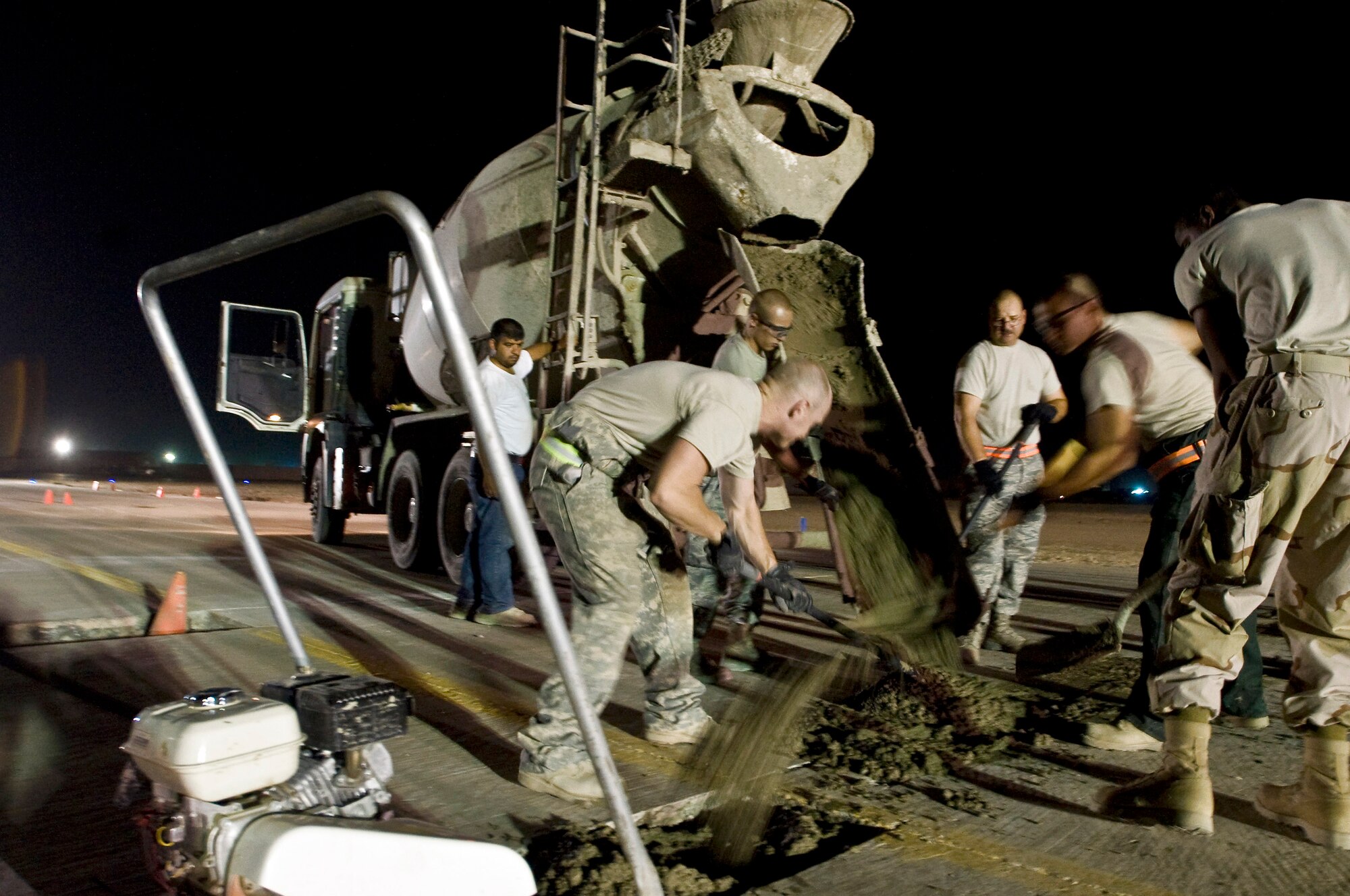 Airmen with the 407th Expeditionary Civil Engineer Squadron repair a section of runway Sept. 22 at Ali Base, Iraq. Extreme heat, along with normal wear and tear, can damage portions of the flightline, making it unsafe for aircraft. (U.S. Air Force photo/Airman 1st Class Christopher Griffin) 
