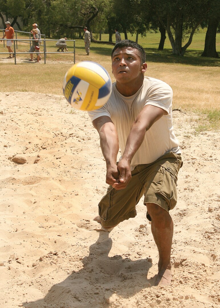 9/19/2008 - Airman 1st Class Misael Iracheta, 37th Logistics Squadron, goes in for the dig during a volleyball game at the Junior Enlisted Apprecation Picnic Sept. 19. The picnic was held at Stillman Park.  (USAF photo by Robbin Cresswell)