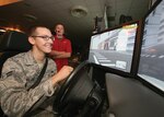9/16/2008 - Airman 1st Class Derek Wilson, 346th Test Squadron, uses the drunken driving simulator Sept. 16 during the Save A Life Tour, a program that informs the public about the serious consequences of drinking and driving. (USAF photo by Robbin Cresswell)