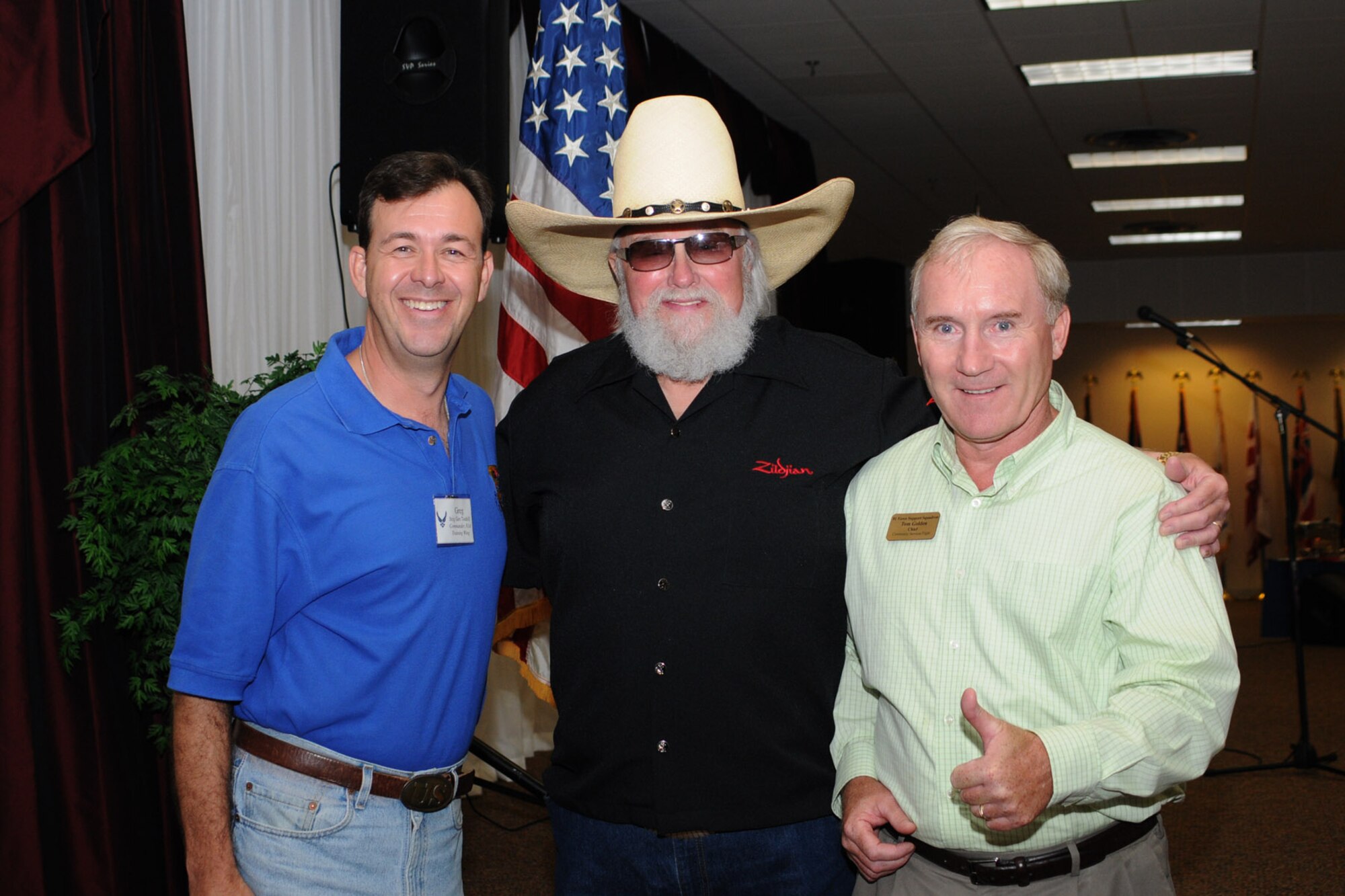 Brigadier gen. Greg Touhill, 81st Training Wing commander, and Tom Golden, 81st Mission Support Group, pose for a photo with Charlie Daniels at a pre-concert reception where Mr. Daniels met with base leadership, local community members and several Keesler Airmen who earned Bronze Stars for their actions in Iraq.  The Charlie Daniels Band performed for Keesler Air Force Base Airmen, families and local community members Sept. 18 to help celebrate the Air Force's 61st birthday.  (U.S. Air Force photo by Kemberly Groue)

