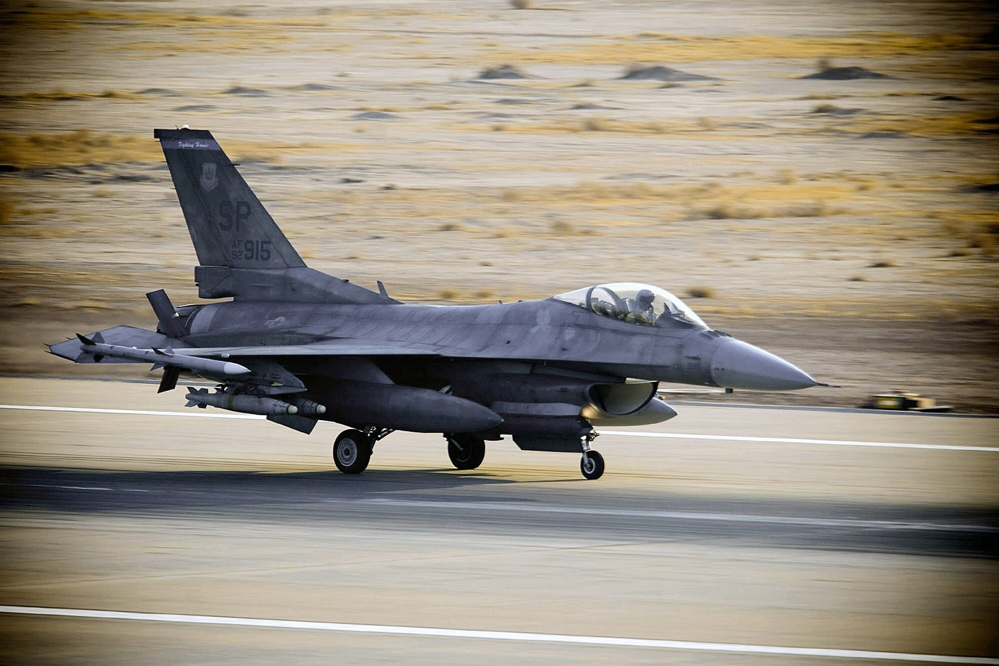 An F-16 Fighting Falcon lands at an air base in Southwest Asia after a mission in support of Operation Iraqi Freedom.  (U.S. Air Force photo/Master Sgt. John Nimmo Sr.)
