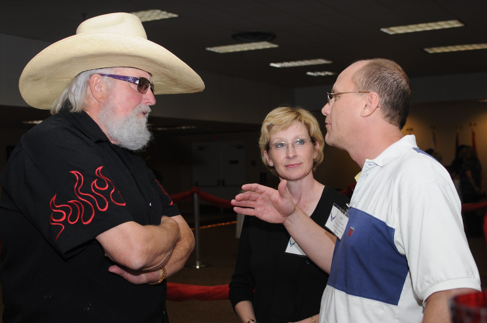 Col. Jeffrey Jackson, 81st Mission Support Group commander, and his wife Lisa pose for a photo with Charlie Daniels at a pre-concert reception where Mr. Daniels met with base leadership, local community members and several Keesler Airmen who earned Bronze Stars for their actions in Iraq.  The Charlie Daniels Band performed for Keesler Air Force Base Airmen, families and local community members Sept. 18 to help celebrate the Air Force's 61st birthday.  (U.S. Air Force photo by Kemberly Groue)

