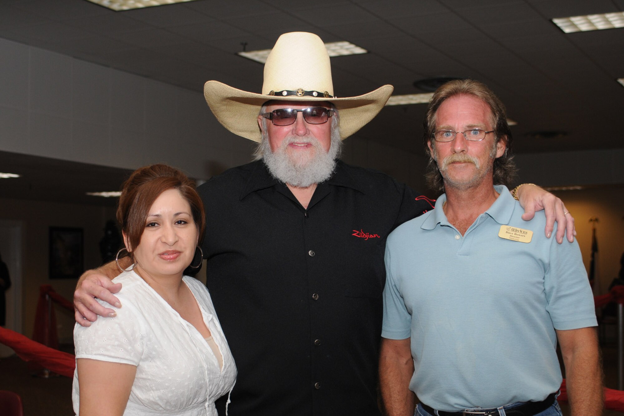 Mr. Dave Bowers,  81 Mission Support Group, and his wife pose for a photo with Charlie Daniels at a pre-concert reception where Mr. Daniels met with base leadership, local community members and several Keesler Airmen who earned Bronze Stars for their actions in Iraq.  The Charlie Daniels Band performed for Keesler Air Force Base Airmen, families and local community members Sept. 18 to help celebrate the Air Force's 61st birthday.  (U.S. Air Force photo by Kemberly Groue)

