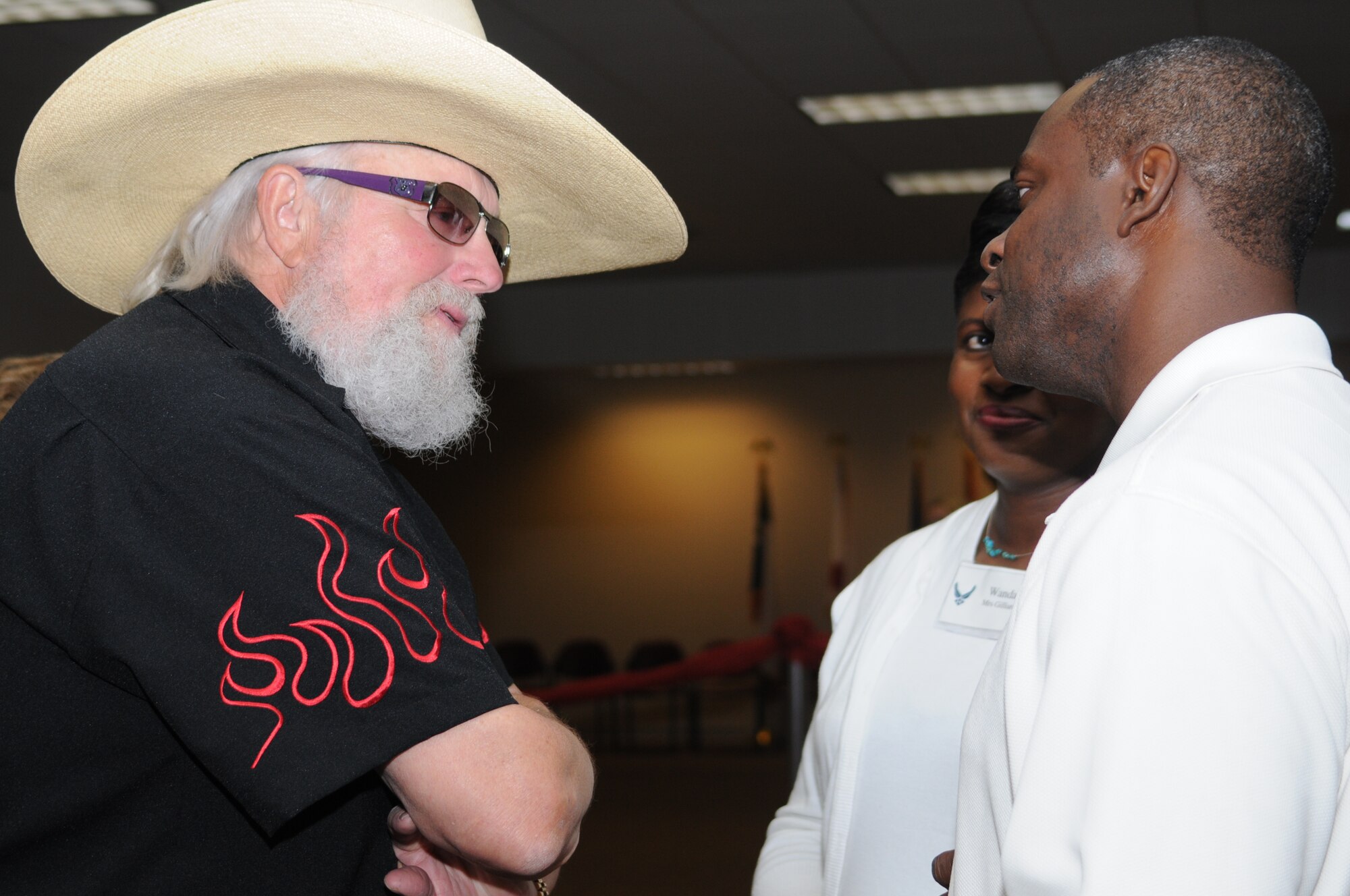 Col. Prince Gilliard, 81st Training Group commander, and his wife Wanda pose for a photo with Charlie Daniels at a pre-concert reception where Mr. Daniels met with base leadership, local community members and several Keesler Airmen who earned Bronze Stars for their actions in Iraq.  The Charlie Daniels Band performed for Keesler Air Force Base Airmen, families and local community members Sept. 18 to help celebrate the Air Force's 61st birthday.  (U.S. Air Force photo by Kemberly Groue)

