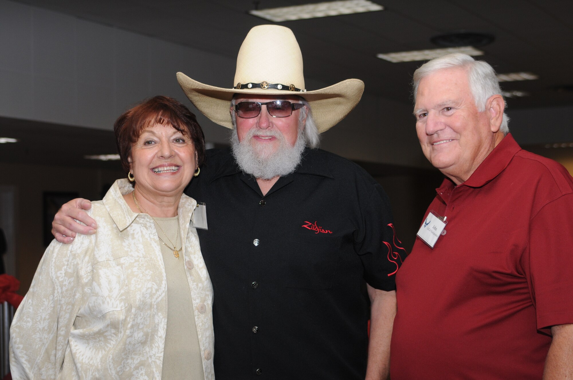Elia and John Vasilopoulos  pose for a photo with Charlie Daniels at a pre-concert reception where Mr. Daniels met with base leadership, local community members and several Keesler Airmen who earned Bronze Stars for their actions in Iraq.  The Charlie Daniels Band performed for Keesler Air Force Base Airmen, families and local community members Sept. 18 to help celebrate the Air Force's 61st birthday.  (U.S. Air Force photo by Kemberly Groue)

