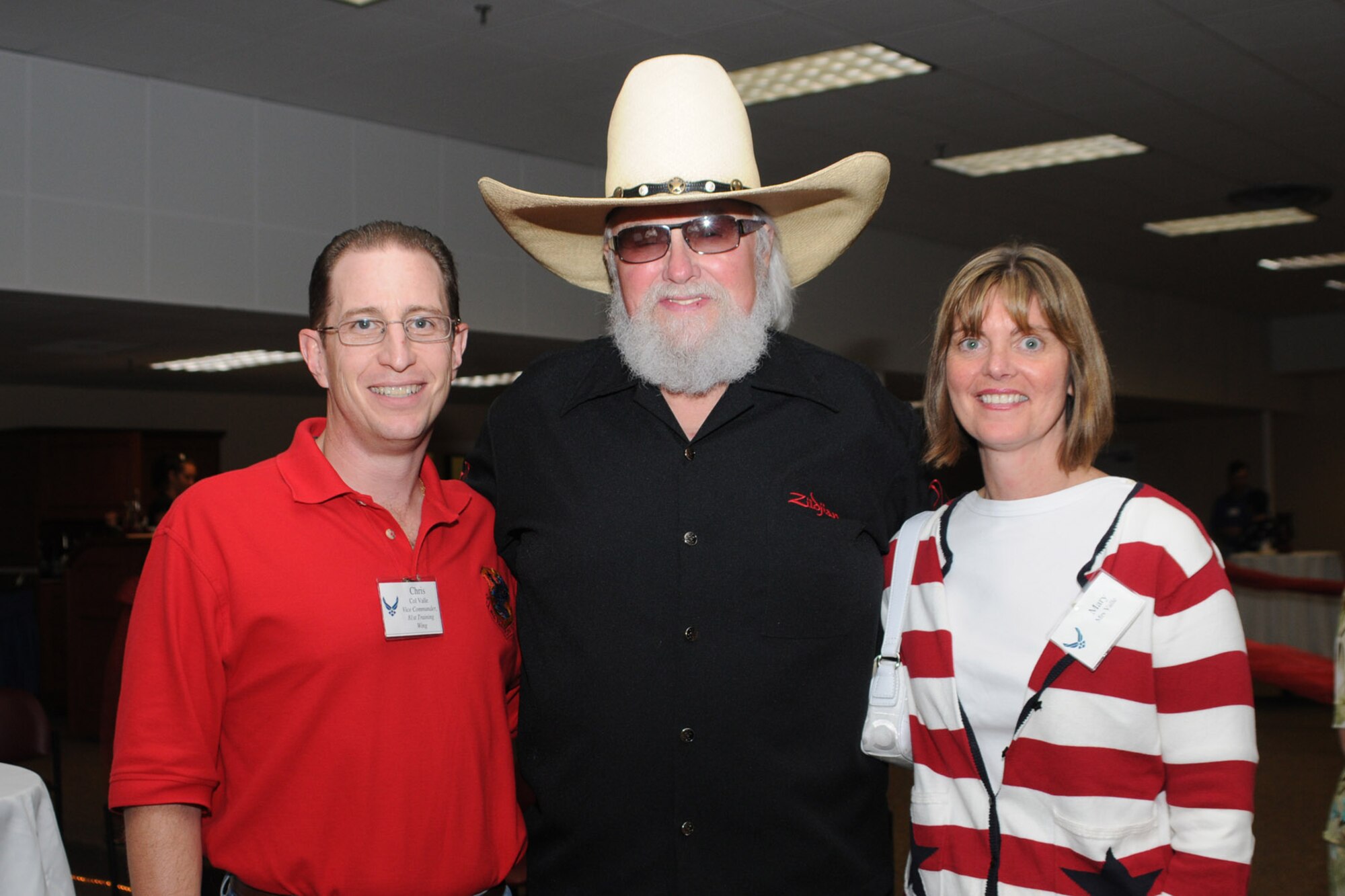 Col. Chris Valle, 81st Training Wing vice commander and his wife Mary pose for a photo with Charlie Daniels at a pre-concert reception where Mr. Daniels met with base leadership, local community members and several Keesler Airmen who earned Bronze Stars for their actions in Iraq.  The Charlie Daniels Band performed for Keesler Air Force Base Airmen, families and local community members Sept. 18 to help celebrate the Air Force's 61st birthday.  (U.S. Air Force photo by Kemberly Groue)

