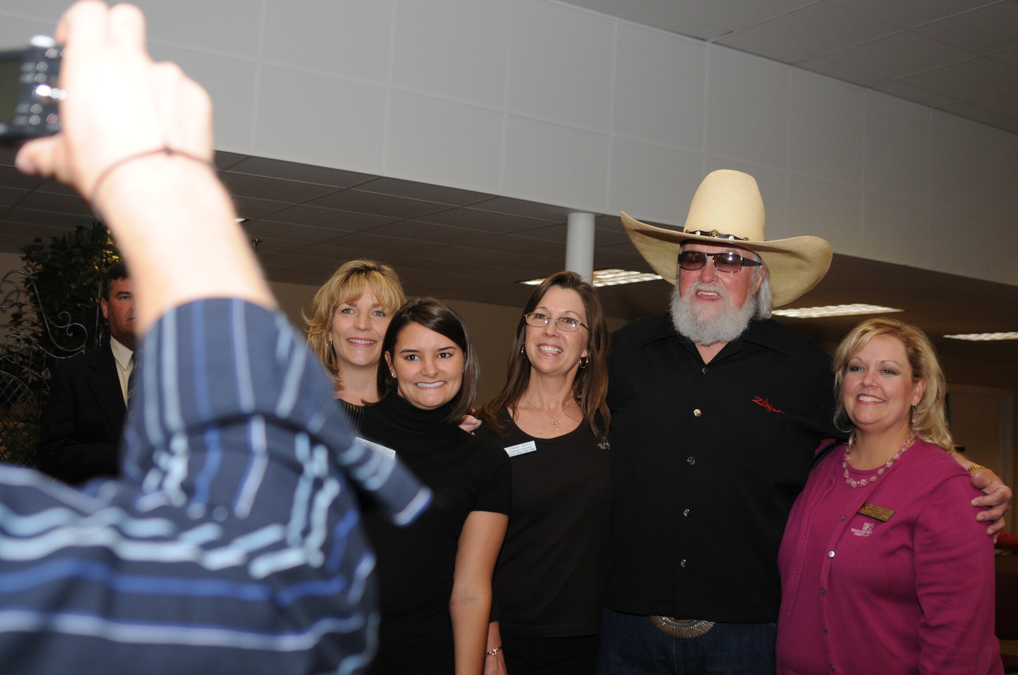 Members of Keesler Federal Credit Union pose for a photo with Charlie Daniels at a pre-concert reception where Mr. Daniels met with base leadership, local community members and several Keesler Airmen who earned Bronze Stars for their actions in Iraq.  The Charlie Daniels Band performed for Keesler Air Force Base Airmen, families and local community members Sept. 18 to help celebrate the Air Force's 61st birthday.  (U.S. Air Force photo by Kemberly Groue)

