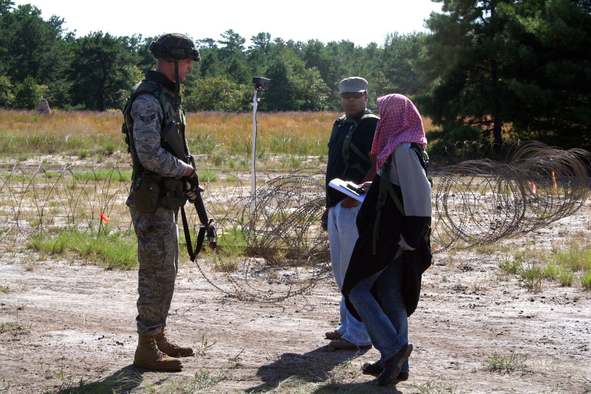 A student in Air Force Exercise Eagle Flag 08-6 meets with "media" during an event for the exercise Sept. 20, 2008, at Naval Air Engineering Station Lakehurst, N.J.  The exercise, operated by the U.S. Air Force Expeditionary Center's 421st Combat Training Squadron at Fort Dix, N.J., tests and trains Airmen in expeditionary combat support skills.  (U.S. Air Force Photo/Tech. Sgt. Scott T. Sturkol)