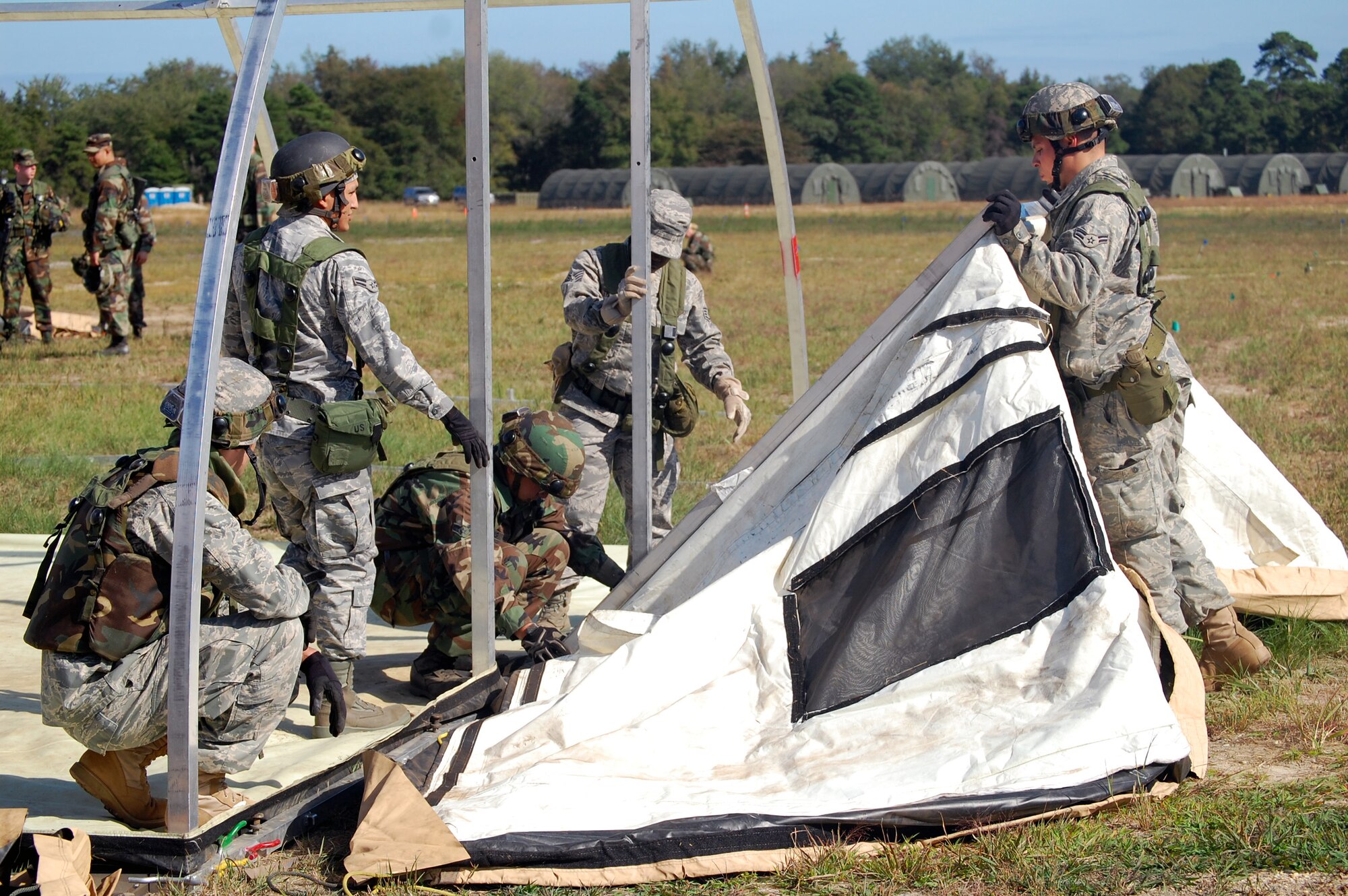 Students in Air Force Exercise Eagle Flag 08-6 build a tent as part of exercise operations Sept. 20, 2008, at Naval Air Engineering Station Lakehurst, N.J.  Eagle Flag is managed by the U.S. Air Force Expeditionary Center's 421st Combat Training Squadron at Fort Dix, N.J., and tests and trains Airmen in expeditionary combat support skills.  (U.S. Air Force Photo/Tech. Sgt. Scott T. Sturkol)