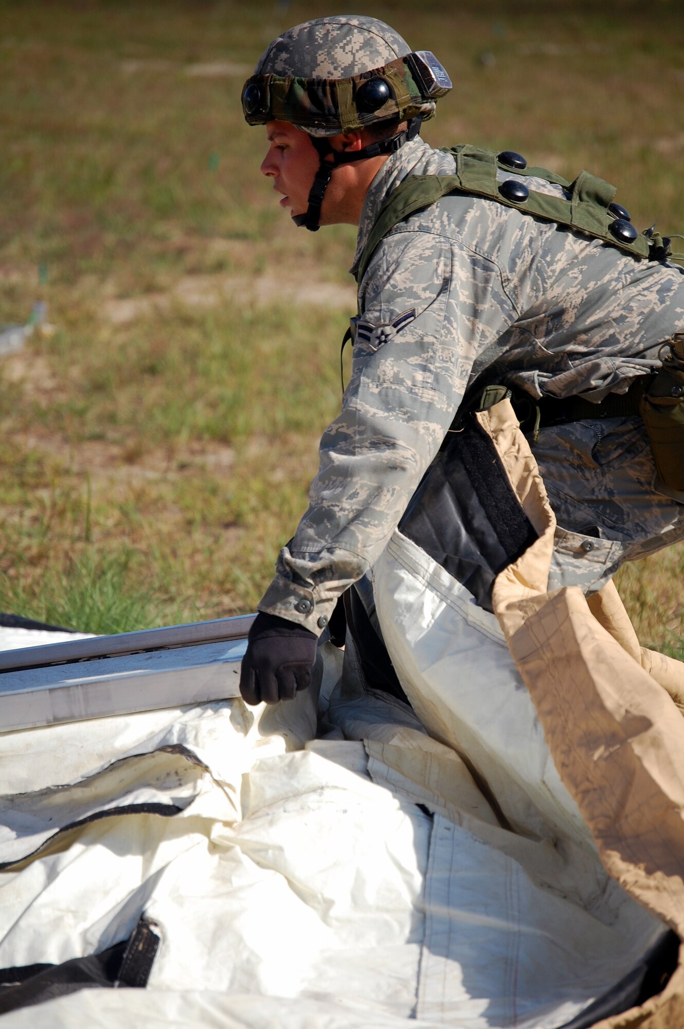A Student in Air Force Exercise Eagle Flag 08-6 builds a tent as part of exercise operations Sept. 20, 2008, at Naval Air Engineering Station Lakehurst, N.J.  Eagle Flag is managed by the U.S. Air Force Expeditionary Center's 421st Combat Training Squadron at Fort Dix, N.J., and tests and trains Airmen in expeditionary combat support skills.  (U.S. Air Force Photo/Tech. Sgt. Scott T. Sturkol)
