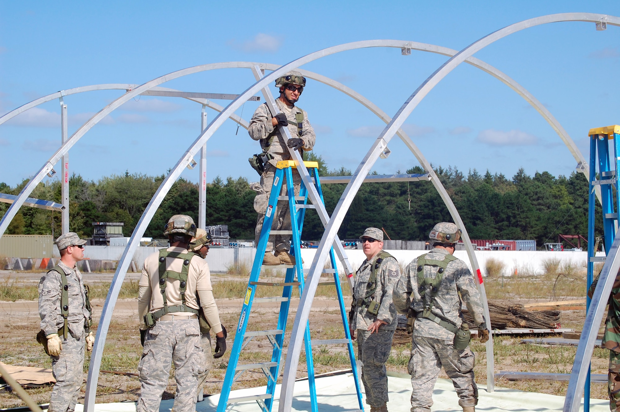 Students in Air Force Exercise Eagle Flag 08-6 build a tent as part of exercise operations Sept. 20, 2008, at Naval Air Engineering Station Lakehurst, N.J.  Eagle Flag is managed by the U.S. Air Force Expeditionary Center's 421st Combat Training Squadron at Fort Dix, N.J., and tests and trains Airmen in expeditionary combat support skills.  (U.S. Air Force Photo/Tech. Sgt. Scott T. Sturkol)