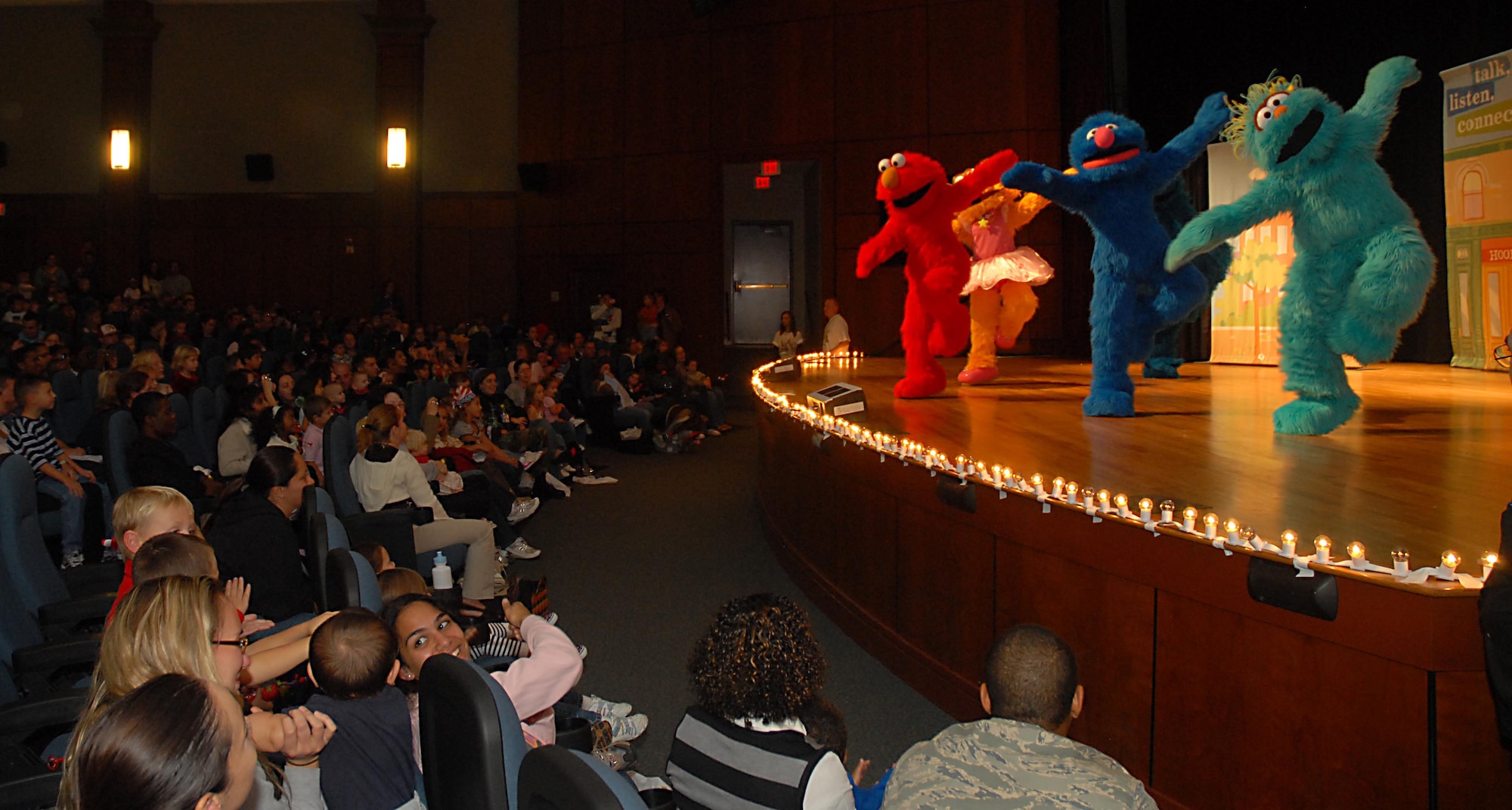 "Sesame Street" characters perform during "The Sesame Street Experience" at the base theater Sept. 25. The initiative of this United Service Organizations program is to provide support and offer resources for military families with young children experiencing the effects of deployment, multiple deployments or when a parent returns home changed due to a combat-related injury. (U.S. Air Force photo/Airman 1st Class Melissa White)