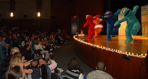 "Sesame Street" characters perform during "The Sesame Street Experience" at the base theater Sept. 25. The initiative of this United Service Organizations program is to provide support and offer resources for military families with young children experiencing the effects of deployment, multiple deployments or when a parent returns home changed due to a combat-related injury. (U.S. Air Force photo/Airman 1st Class Melissa White)