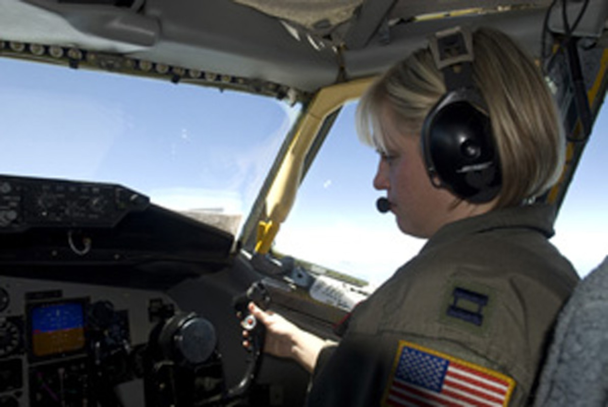Captain Jenette Jensen, a KC-135 Stratotanker pilot assigned to the 465th Air Refueling Squadron keeps an eye on her instruments during an air refueling mission near the Hawaiian Islands during Exercise Rim of the Pacific 2008.  RIMPAC, the world’s largest multinational exercise, is scheduled biennially by U.S. Pacific Fleet and takes place in the Hawaiian operating area during 29 June - 31 July 2008.  Participants include Australia, Canada, Chile, Japan, Netherlands, Peru, Republic of Korea, Singapore, United Kingdom and the U.S.    U S Navy photo by Mass Communications Specialist 2nd Class (AW/NAC) Scott Taylor. (Released)
