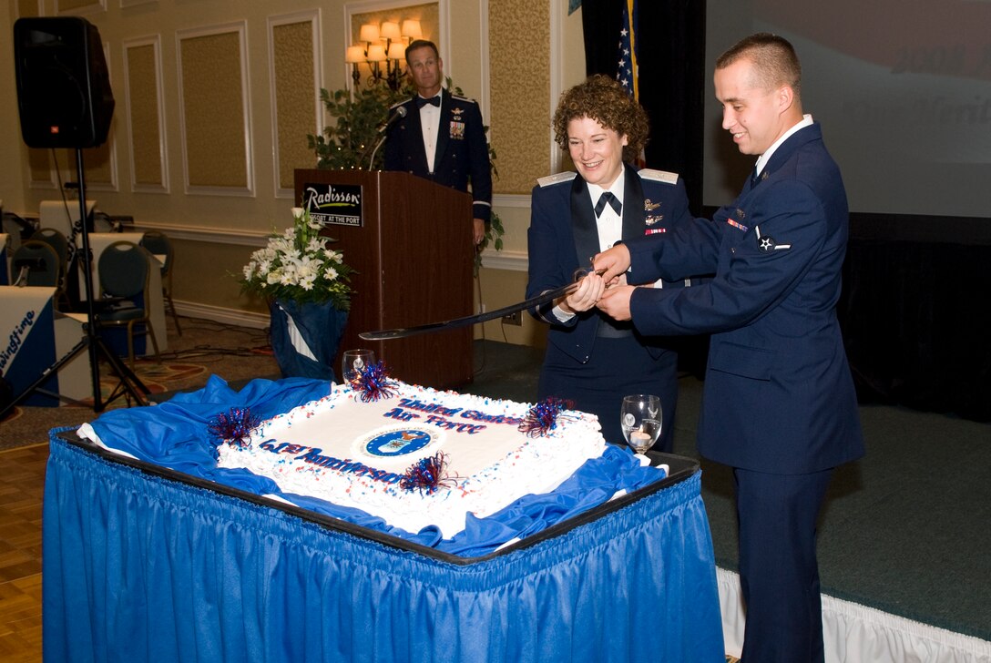 At the 2008 Air Force Ball 45th Space Wing Commander Brig. Gen. Susan Helms cuts the ceremonial birthday cake with the most junior enlisted member, Airman Edward Tower. (U.S. Air Force photo by Jim Laviska)