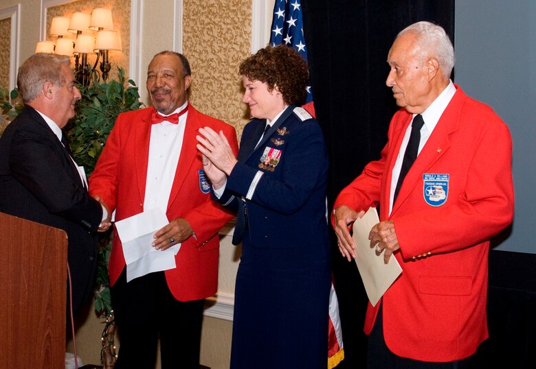 Brig. Gen. Susan Helms and local Air Force Association President Chris Bailey (left)
thank John Gay and Donald Williams, two of several Tuskegee Airmen who attended
the 45th Space Wing’s annual Air Force Ball September 20 and helped the Wing celebrate the Air Force’s 61st birthday. (U.S. Air Force photo by Jim Laviska)