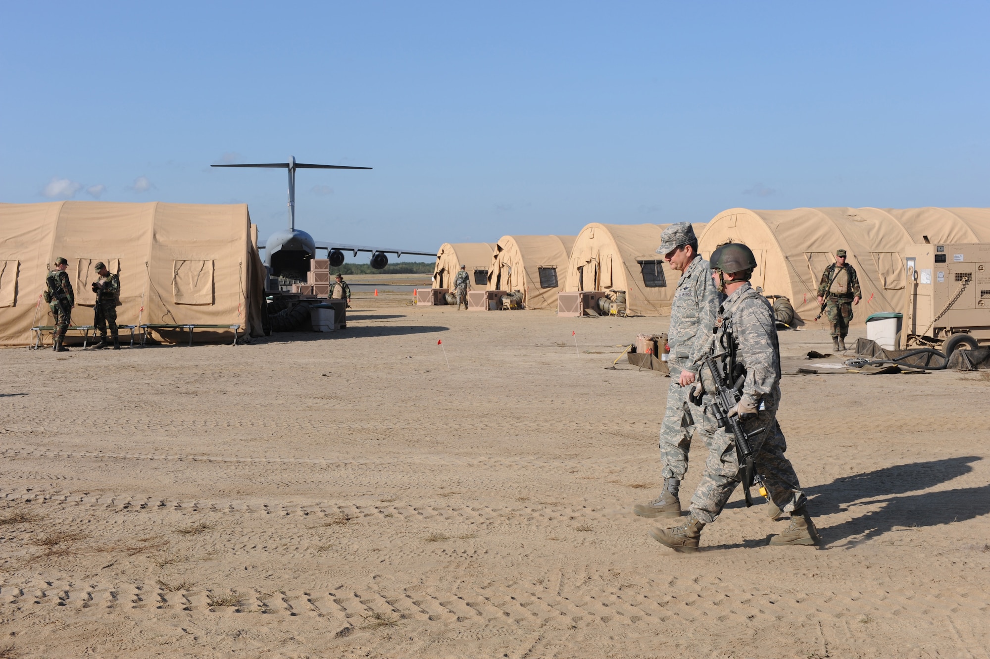Lt. Gen. Vern "Rusty" Findley, Air Mobility Command vice commander, walks with Col. Jim Hamilton, 816th Contingency Response Group commander from McGuire Air Force Base, N.J., as part of a tour of the CRG camp area and Eagle Flag Sept. 23, 2008, at Naval Air Engineering Station Lakehurst, N.J.  Besides Eagle Flag, General Findley visited the U.S. Air Force Expeditionary Center on Fort Dix, N.J., and McGuire to learn more about training and operations taking place in all areas.  (U.S. Air Force Photo/Staff Sgt. Nathan Bevier) 