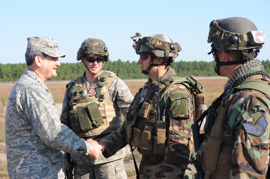 Lt. Gen. Vern "Rusty" Findley, Air Mobility Command vice commander, visits Airmen from the 816th Contingency Response Group from McGuire Air Force Base, N.J., as part of a tour of the CRG camp area and Eagle Flag Sept. 23, 2008, at Naval Air Engineering Station Lakehurst, N.J.  Besides Eagle Flag, General Findley visited the U.S. Air Force Expeditionary Center on Fort Dix, N.J., and McGuire to learn more about training and operations taking place in all areas.  (U.S. Air Force Photo/Staff Sgt. Nathan Bevier) 