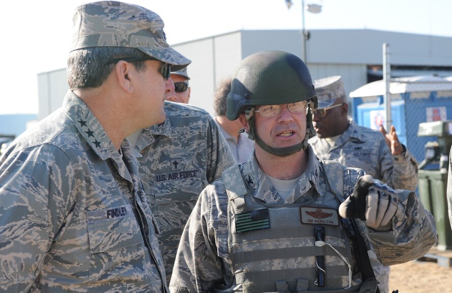 Lt. Gen. Vern "Rusty" Findley, Air Mobility Command vice commander, visits with Col. Jim Hamilton, 816th Contingency Response Group commander from McGuire Air Force Base, N.J., as part of a tour of the CRG camp area and Eagle Flag Sept. 23, 2008, at Naval Air Engineering Station Lakehurst, N.J.  Besides Eagle Flag, General Findley visited the U.S. Air Force Expeditionary Center on Fort Dix, N.J., and McGuire to learn more about training and operations taking place in all areas.  (U.S. Air Force Photo/Staff Sgt. Nathan Bevier) 