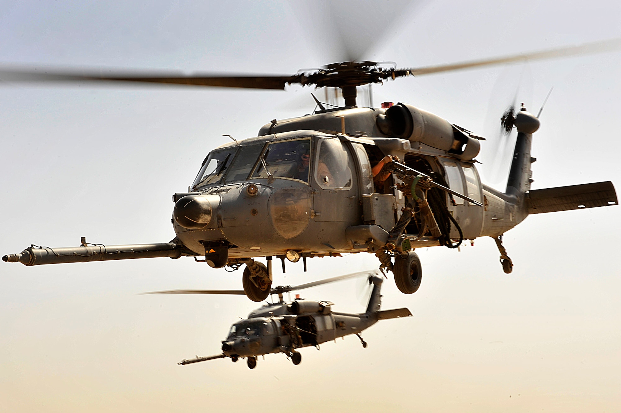 HH-60G Pave Hawks from the 66th Expeditionary Rescue Squadron fly over an area in Iraq during an operational training exercise Sept. 19.  (U.S. Air Force photo/Staff Sgt. Aaron Allmon)

