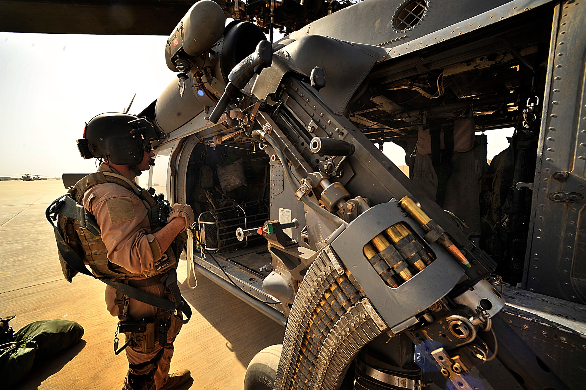 Staff Sgt. Ben Vorheis, a flight engineer with the 66th Expeditionary Rescue Squadron, conducts a pre-flight inspection on a HH-60G Pave Hawk Sept.19 before a proficiency training exercise at Joint Base Balad, Iraq. (U.S. Air Force photo/Staff Sgt. Aaron Allmon)

