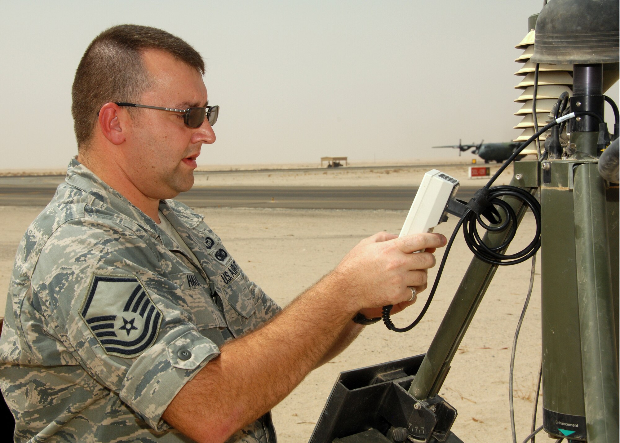 SOUTHWEST ASIA -- Master Sgt. Scott Hauser, 386th Expeditionary Operations Support Squadron Weather flight NCO in charge, conducts a preventive maintenance inspection on an AN/TMQ-53 Tactical Meteorological Observing System (TMOS) on Sept. 26 at an air base in Southwest Asia. The Weather flight provides accurate weather information to protect base assets including personnel, structures, equipment and the airfield from adverse weather conditions. Sergeant Hauser is deployed from the 14th Weather Squadron in Asheville, N.C. (U.S. Air Force photo/Tech. Sgt. Raheem Moore)