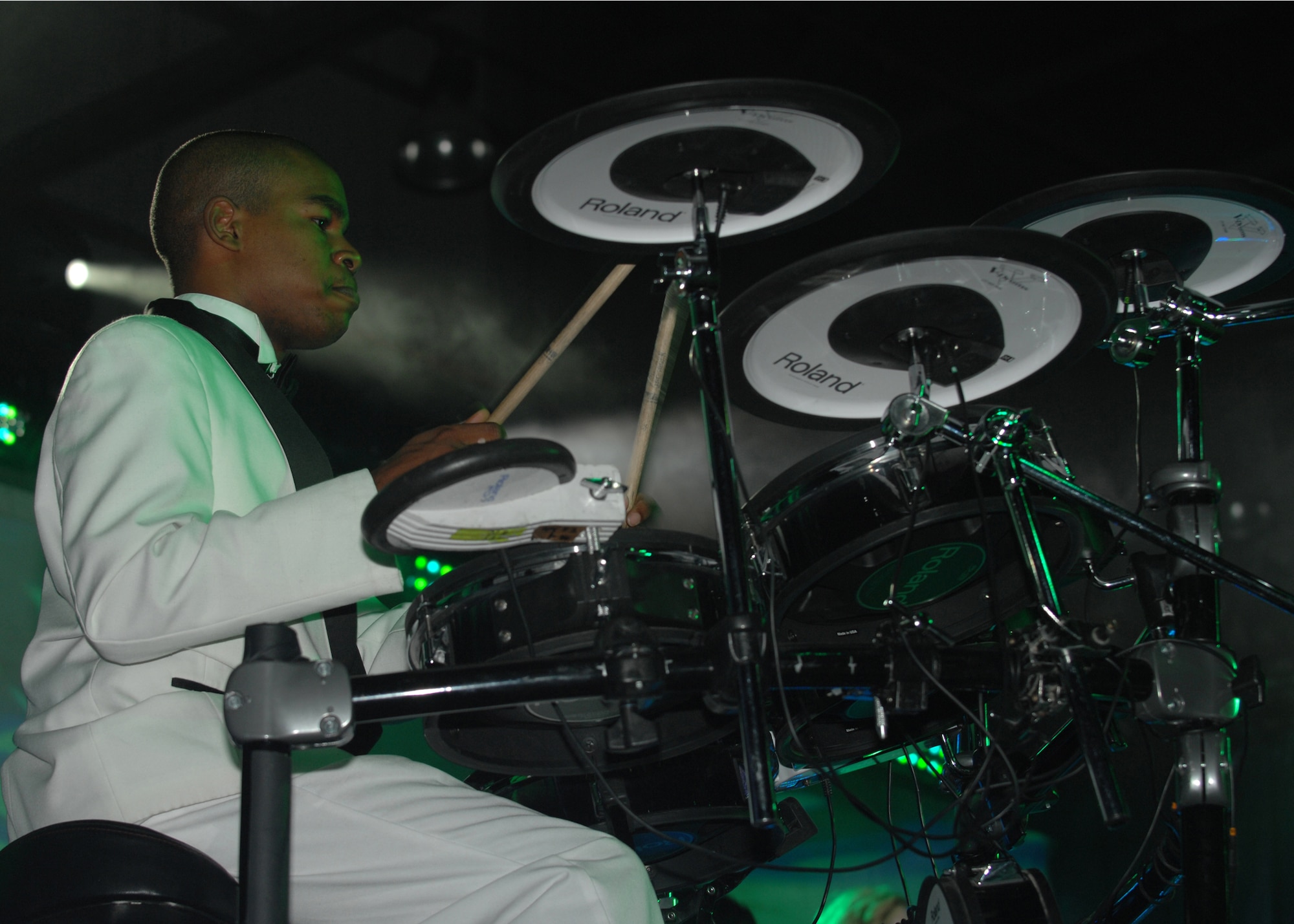 Airman 1st Class Christopher Gadson beats on the drums for a musical number during a Tops in Blue performance at Incirlik Sept. 23. Airman Gadson is one of two drummers for this year's world tour. (U.S. Air Force photo by Staff Sgt. Jeff Nevison)