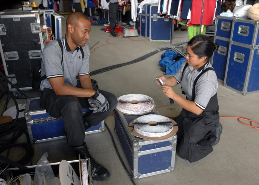 Tech. Sgt. Lamon Mabron, Tops in Blue keyboardist, and 2nd Lt. Rhonda Lazo, Tops in Blue vocalist, organize strips of Velcro for stage props in preparation for a performance at incirlik Sept. 23. (U.S. Air Force photo by Staff Sgt. Jeff Nevison)