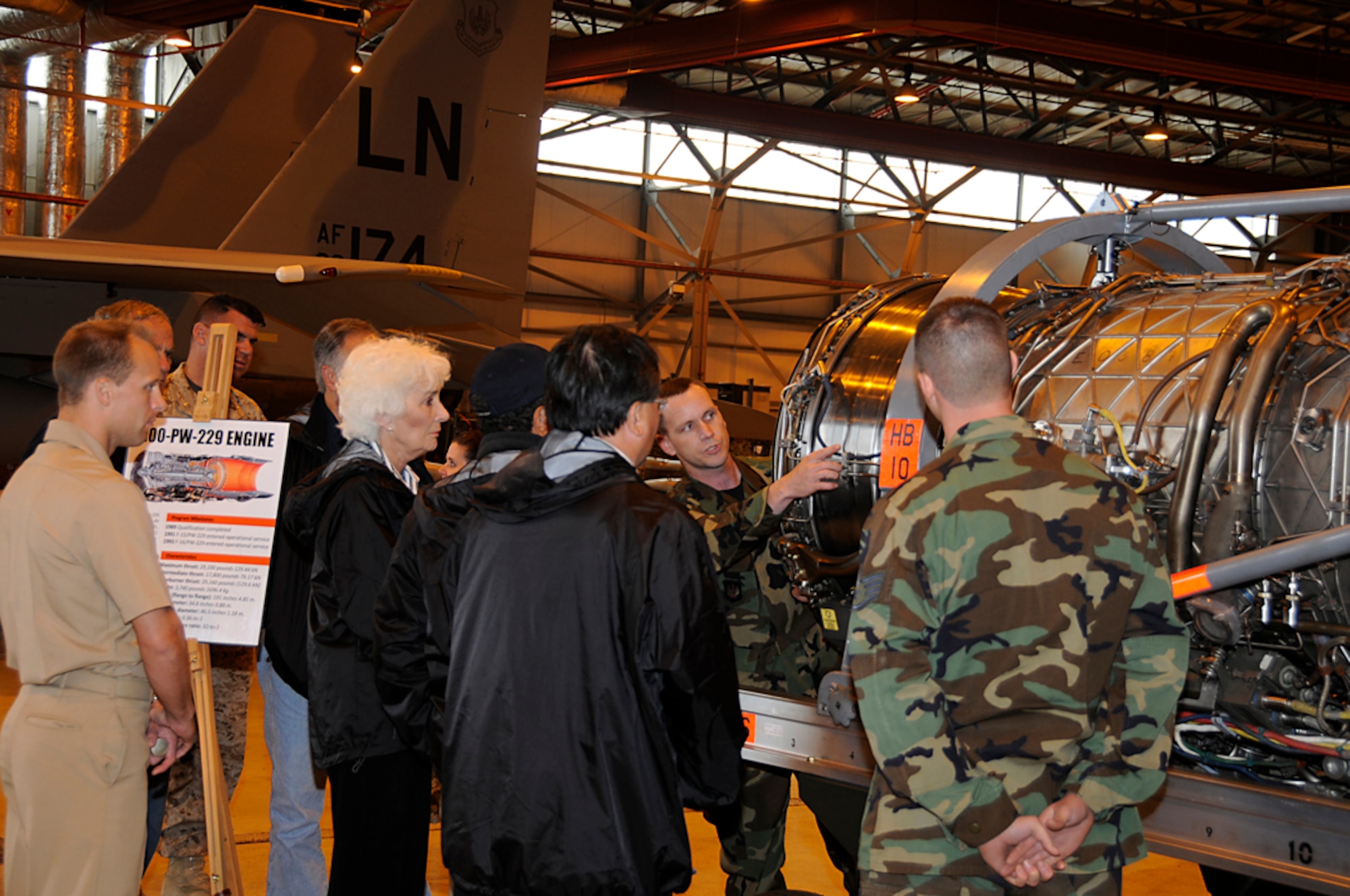 Tech. Sgt. Charles Hoyt, 48th Component Maintenance Squadron, briefs Joint Civilian Orientation Conference attendees at RAF Lakenheath, England Sept. 23. Sergeant Hoyt briefed the attendees about the F100-FW-229 and F100-FW-220 engines that enable the F-15 Eagle and F-15 Strike Eagle to fly. (U.S. Air Force photo by Senior Airman Brian J. Ellis)