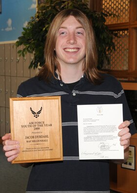 Jacob Dybdahl 18, shows off his plaque and certificate for winning the base level Air Force “Youth of the Year Award” on Sept. 25, 2008, at RAF Mildenhall, England. To be nominated for the award, an individual must be recognized by his or her family and peers by showing community involvement, having strong leadership traits, and setting educational and life goals. Jacob has volunteered countless hours with programs at the Youth Center and projects around the community. He is also the Mildenhall Key Stone Club president and is currently involved with many other programs. (U.S. Air Force photo by Staff Sgt. Jerry Fleshman)
