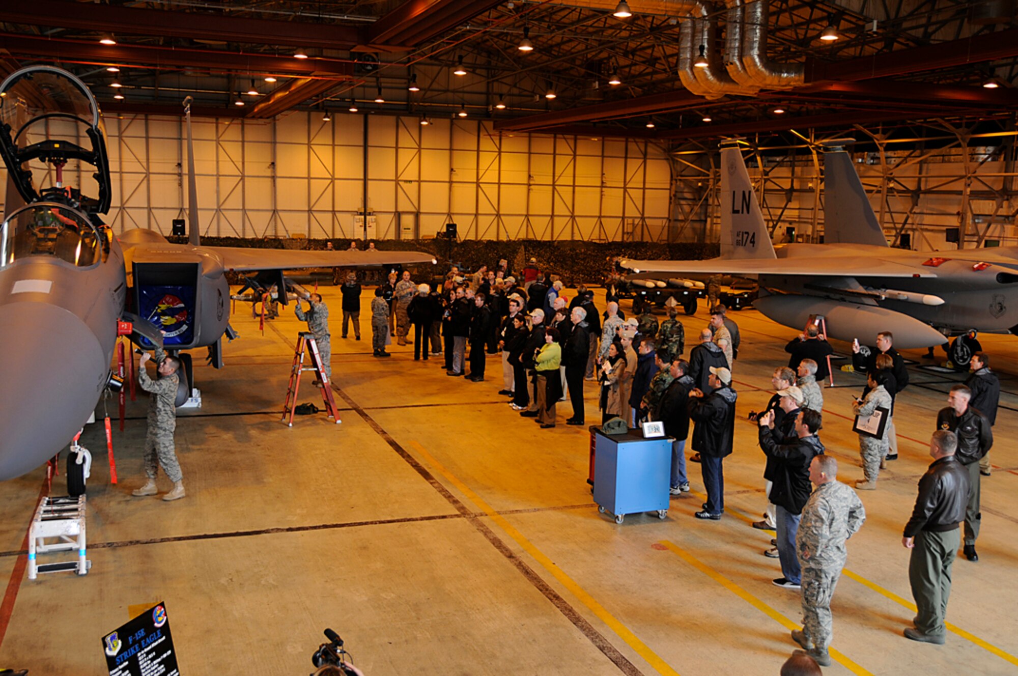Members attending the Joint Civilian Orientation Conference watch a weapons load demo at RAF Lakenheath, England Sept. 23. RAF Lakenheath was one of many stops as the JCOC group toured the United States European Command. (U.S. Air Force photo by Senior Airman Brian J. Ellis)