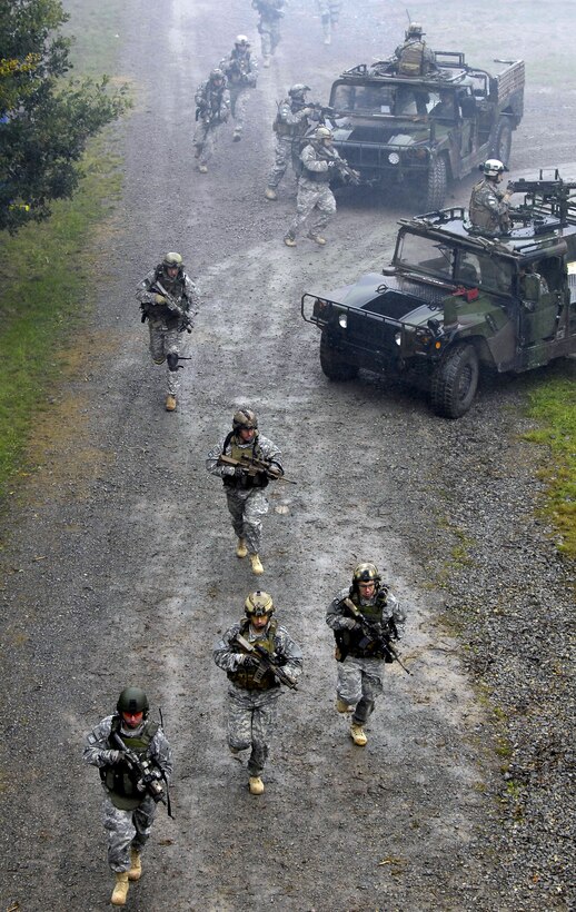 U.S. Army Operations Detachment Alpha members from the 10th Special Forces Group demonstrate to the participants of the 76th Joint Civilian Orientation Conference how to seize a compound on their training area in Stuttgart, Germany, Sept. 25, 2008. 