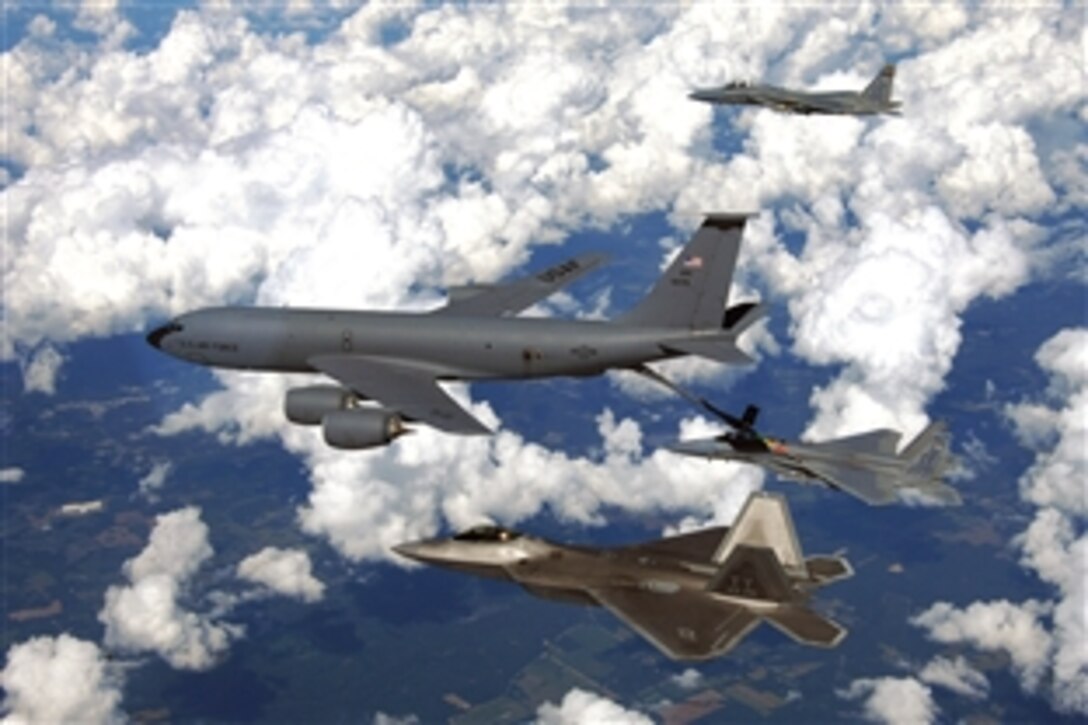 A Mississippi Air National Guard KC-135 Stratotanker refuels an F-15 Eagle over eastern Florida as another F-15 and an F-22 Raptor from Tyndall Air Force Base, Fla., wait their turn, Sept. 22, 2008. 