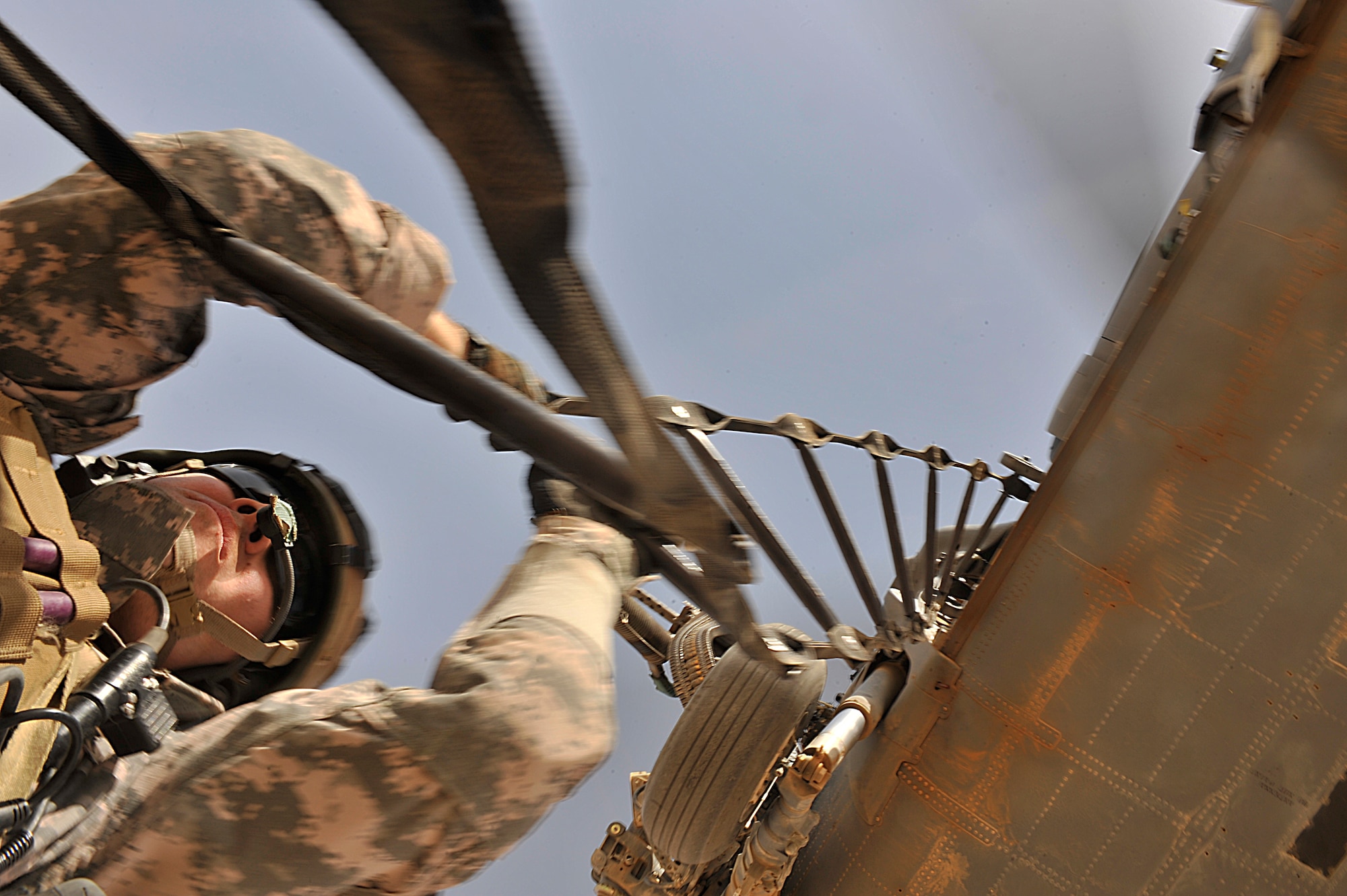 U.S. Air Force Pararescuemen Staff Sgt. Jeremy Diola of the 66th Expeditionary Rescue Squadron uses a rope ladder to get back aboard an HH-60G Pave Hawk during a training mission in Iraq. (Photo by Staff Sgt. Aaron Allmon)

