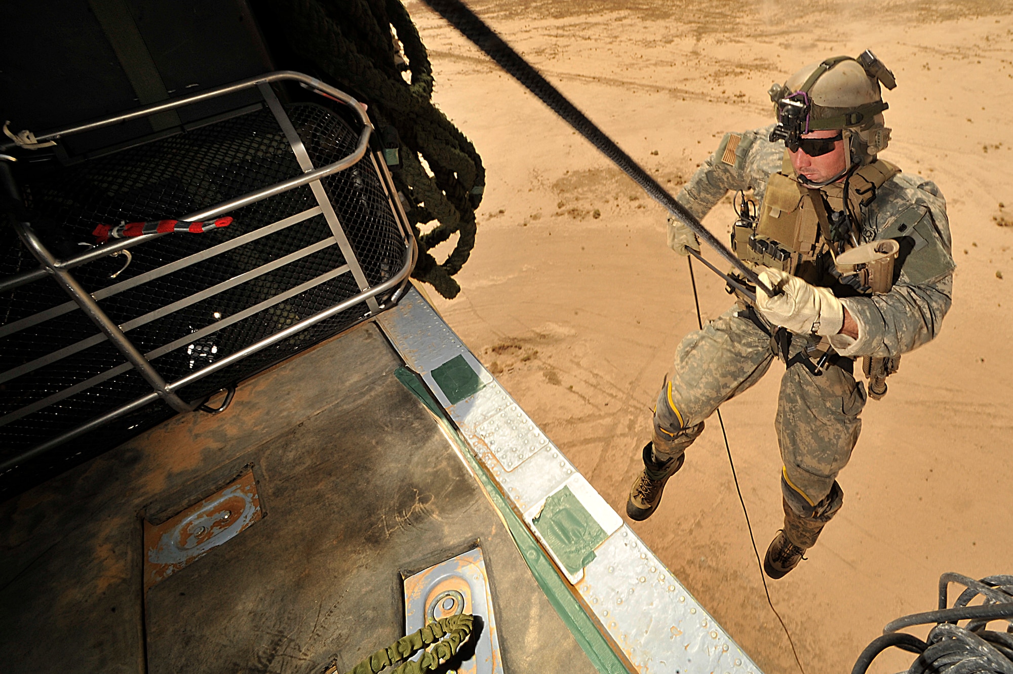 U.S. Air Force Pararescuemen Senior Airman Corey Farr of the 66th Expeditionary Rescue Squadron rappels from a  HH-60G Pave Hawk during operational training in Iraq on  Sept. 19. (Photo by Staff Sgt. Aaron Allmon) 


