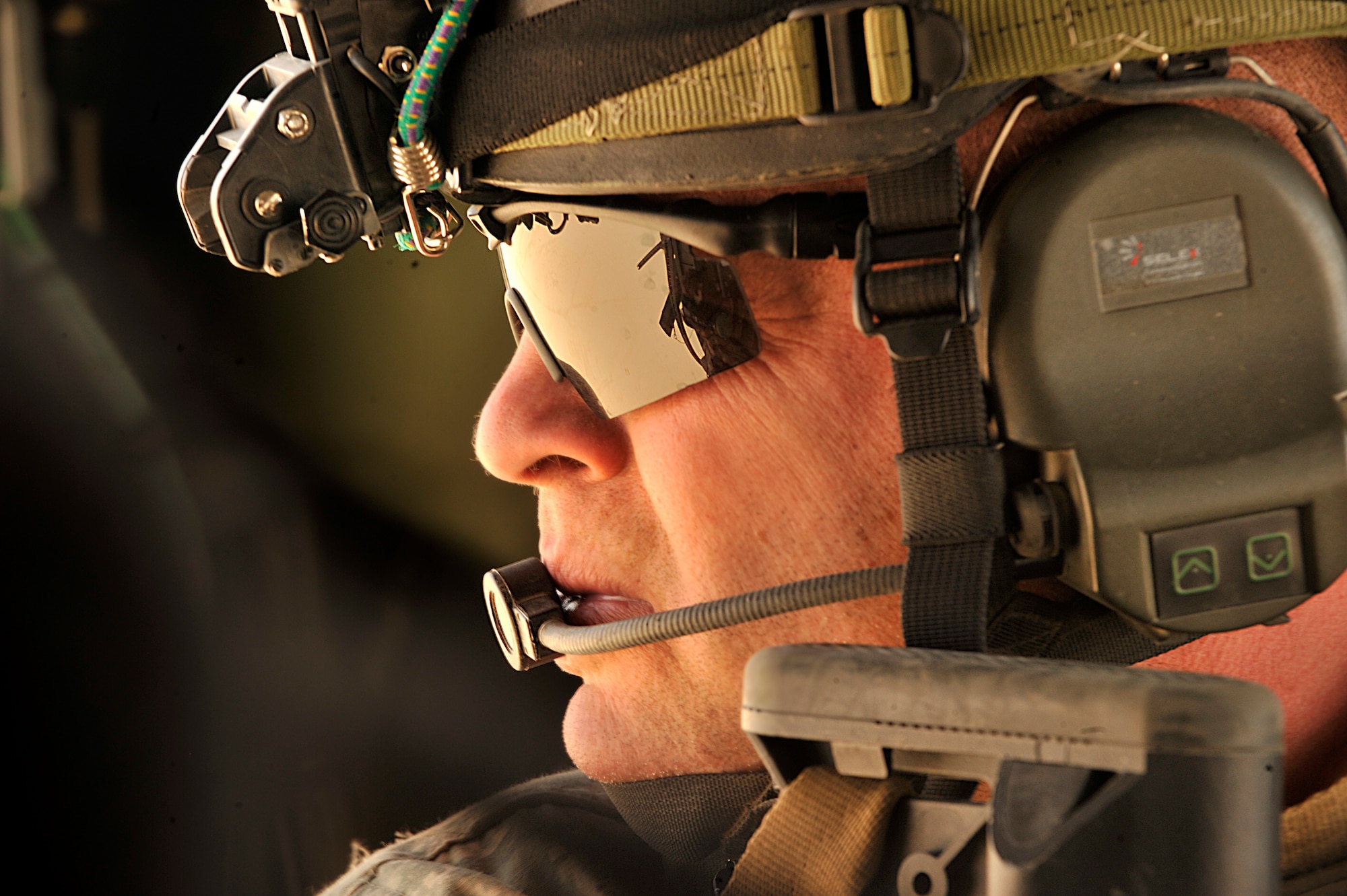 U.S. Air Force Pararescuemen Senior Master Sgt. Michael Fleming of the 66th Expeditionary Rescue Squadron scans from a  HH-60G Pave Hawk during operational training in Iraq. (U.S. Air Force photo by Staff Sgt. Aaron Allmon) 
 
