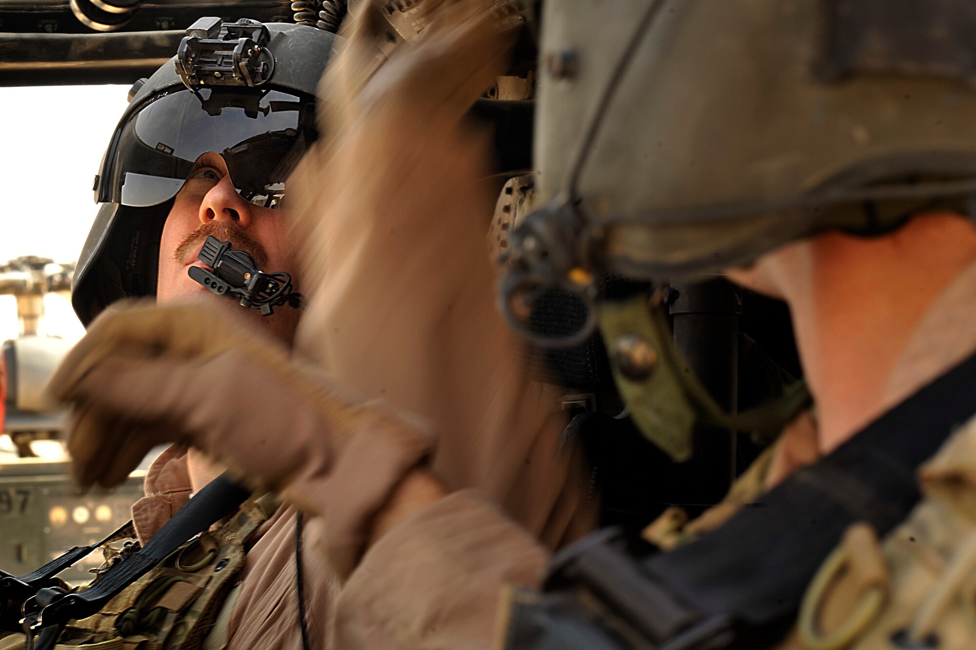 U.S. Air Force Pilot Capt. Ryan Kay of the 66th Expeditionary Rescue Squadron conducts pre-flight checks on a HH-60G Pave Hawk prior to an operational training mission with Pararescueman from Joint Base Balad, Iraq, Sept. 19. (U.S. Air Force photo by Staff Sgt. Aaron Allmon) 
 
