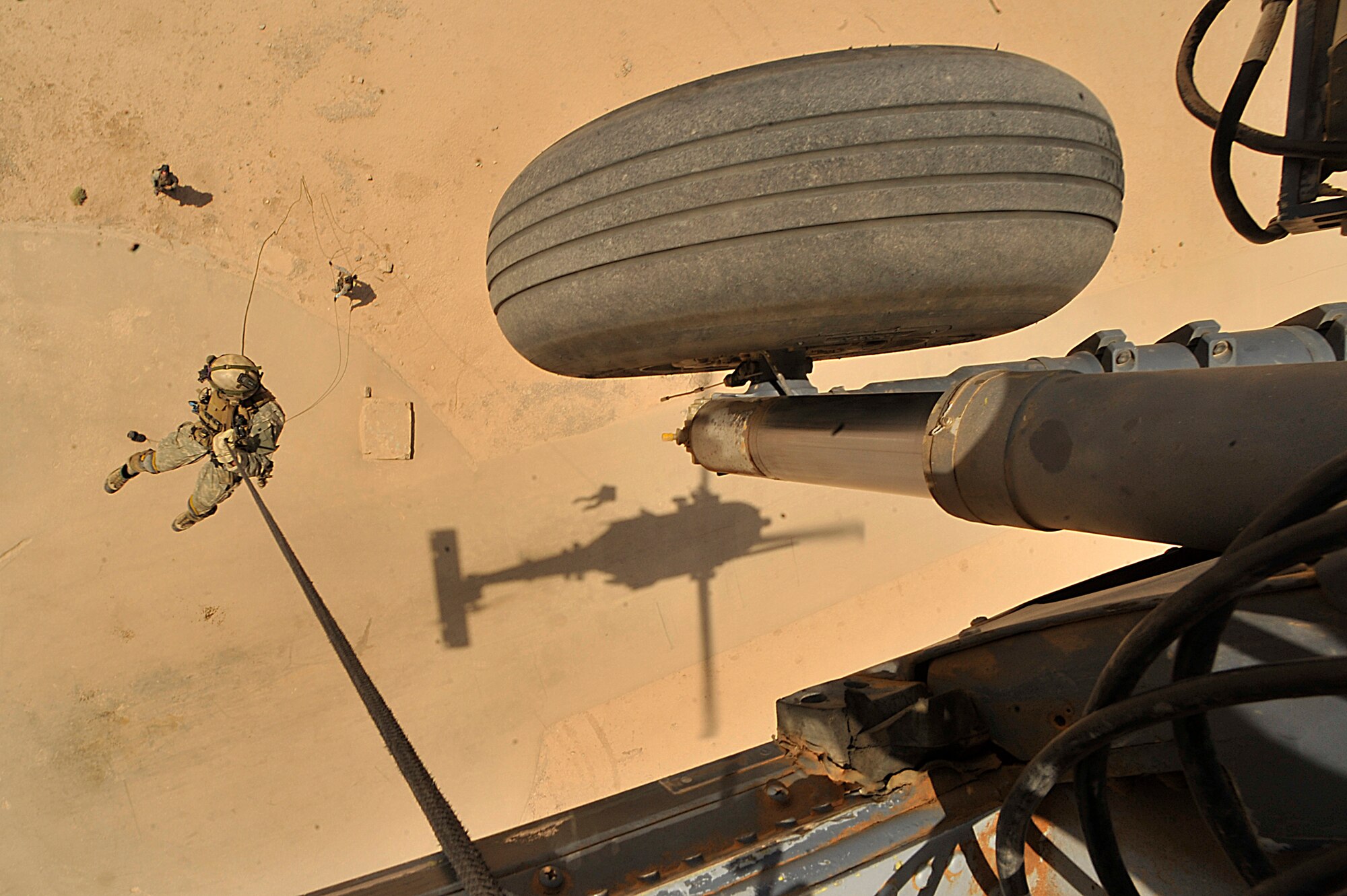 U.S. Air Force Pararescuemen Senior Airman Corey Farr of the 66th Expeditionary Rescue Squadron repels from an HH-60G Pave Hawk during an operational training mission in Iraq on Sept. 19.  (U.S. Air Force photo by Staff Sgt. Aaron Allmon) 
 
