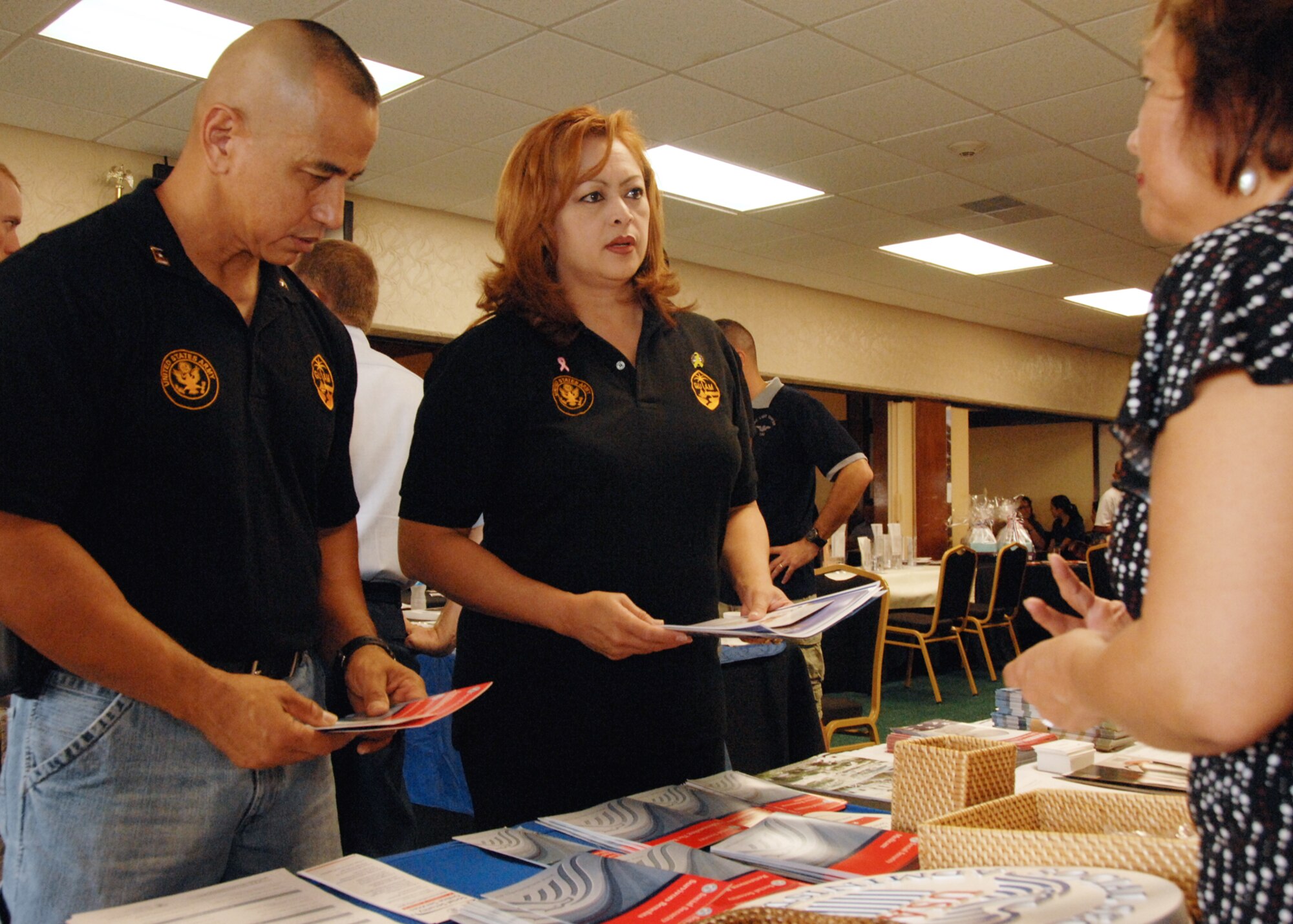 ANDERSEN AIR FORCE BASE, Guam - Military retirees and their families receive information on services provided by different base agencies and organizations at the Palm Tree Golf Course Ballroom here Sept. 27. Many organizations were present to support Retiree Appreciation Day. (U.S. Air Force photo by Airman 1st Class Nichelle Griffiths)