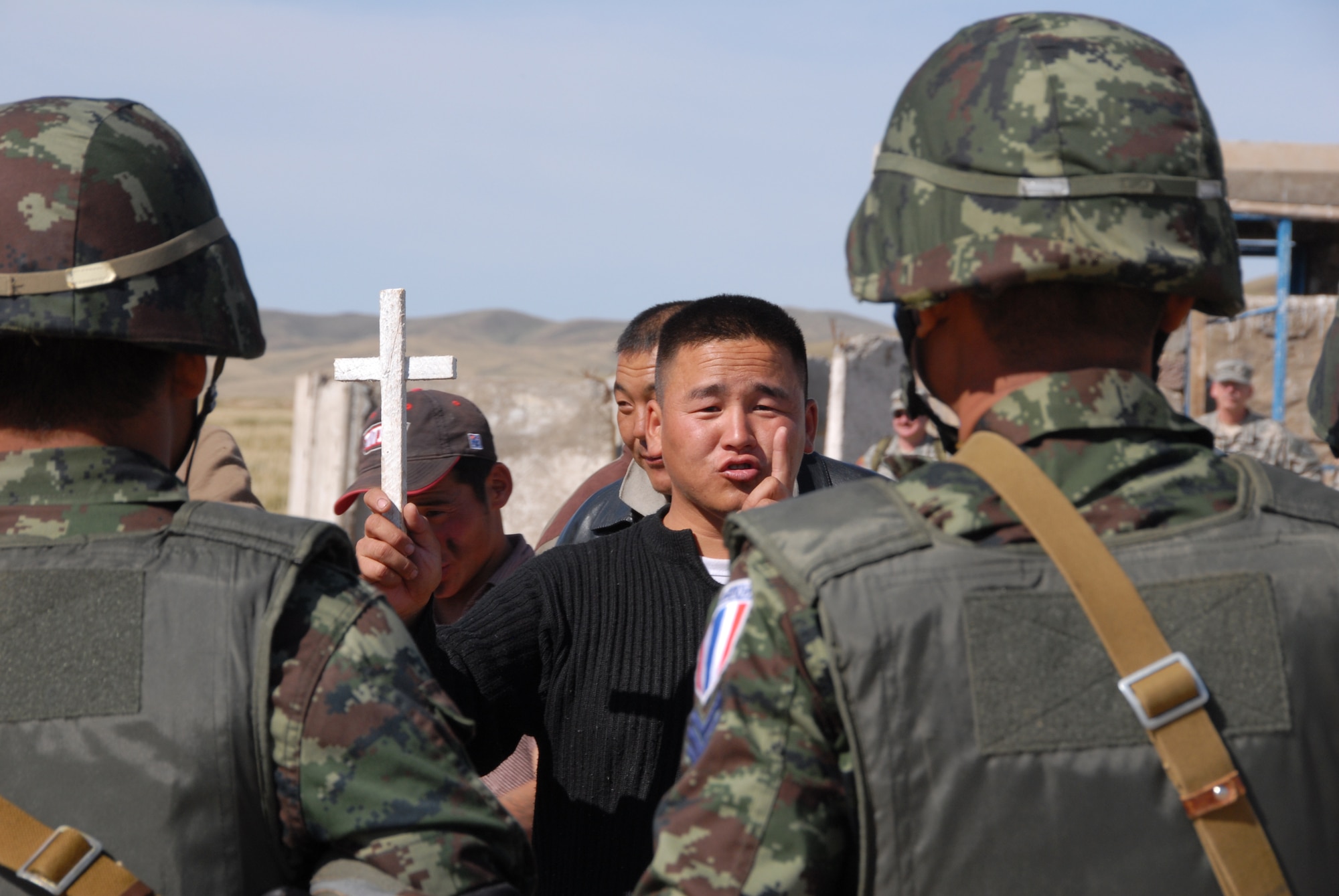 Soldiers from Thailand rehearse peace-keeping exercises with Mongolian role players during the field-training exercise Khaan Quest 2008, a United Nations multinational peace support exercise in Mongolia at Camp Five Hills Training Center near Ulaan Baatar. Alaska Air National Guard photo by MSgt Jules Barklow  
