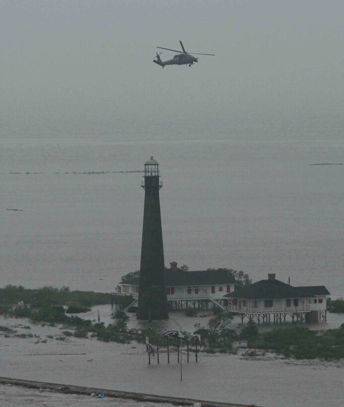 An HH-60 Pave Hawk helicopter from the Alaska Air National Guard's 176th Wing flies over  flooded Galveston Island, Texas, on Sept. 13, 2008, shortly after Hurricane Ike's arrival. The 176th Wing deployed two helicopters and about 30 wing members to the Gulf Coast region Sept. 1 to perform expected search-and-rescue missions in the wake of Hurricane Gustav. They remained in the region to aid rescue efforts relating to Hurricane Ike. Alaska Air National Guard photo by TSgt. Sean Mitchell.