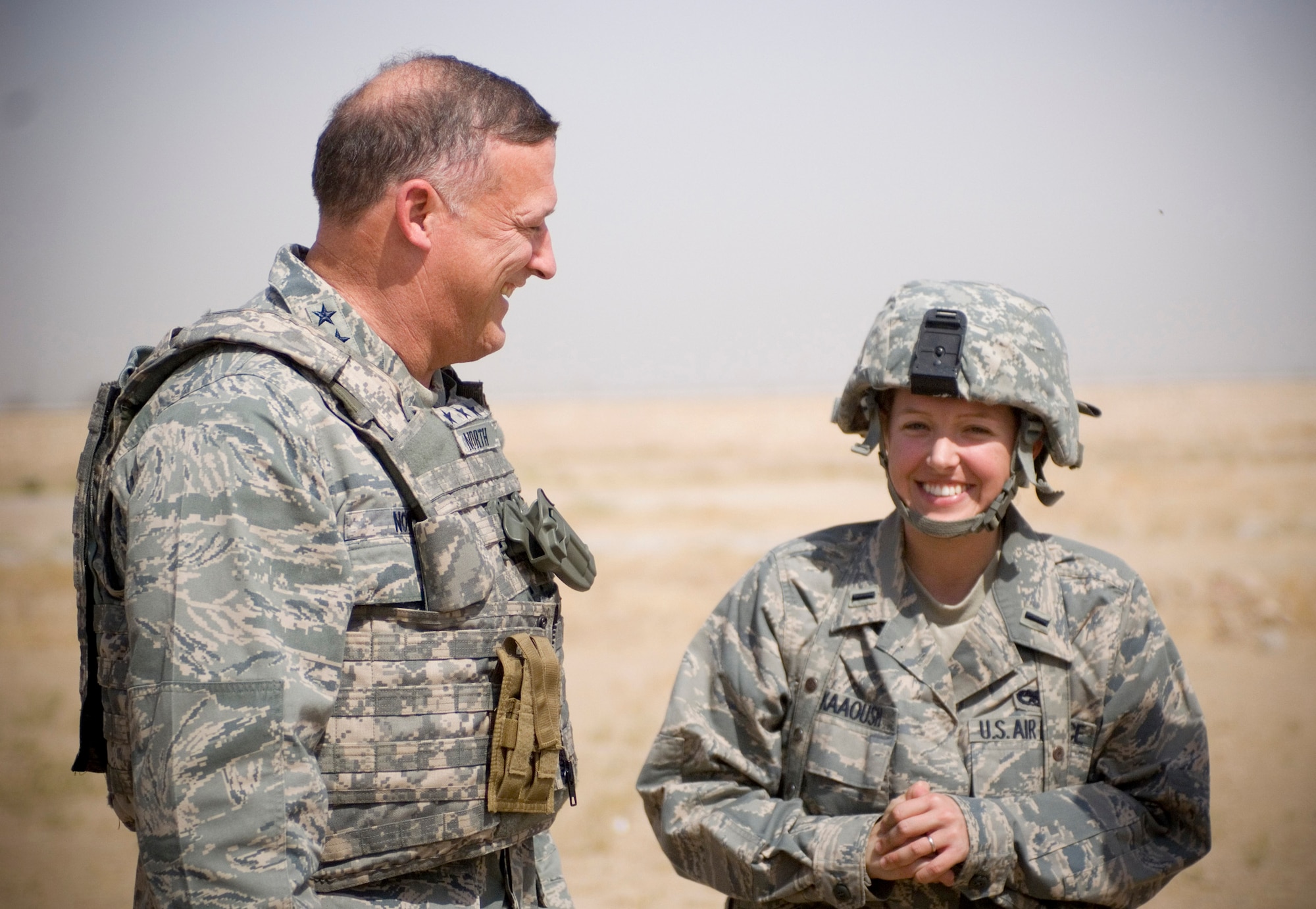 Lt. Gen. Gary North,  U.S. Air Forces Central commander, shares a laugh with 1st Lt. Kierra Kaaoush, 209th Afghan Regional Security Integration Command - North liaison officer, at Camp Spann in the Balakh Province, Afghanistan, Sept. 26. Lieutenant Kaaoush?s mother, a retired chief master sergeant, had asked the general to check on her daughter during his visit. While at Camp Spann, General North held an Airman?s Call and recognized outstanding performers.