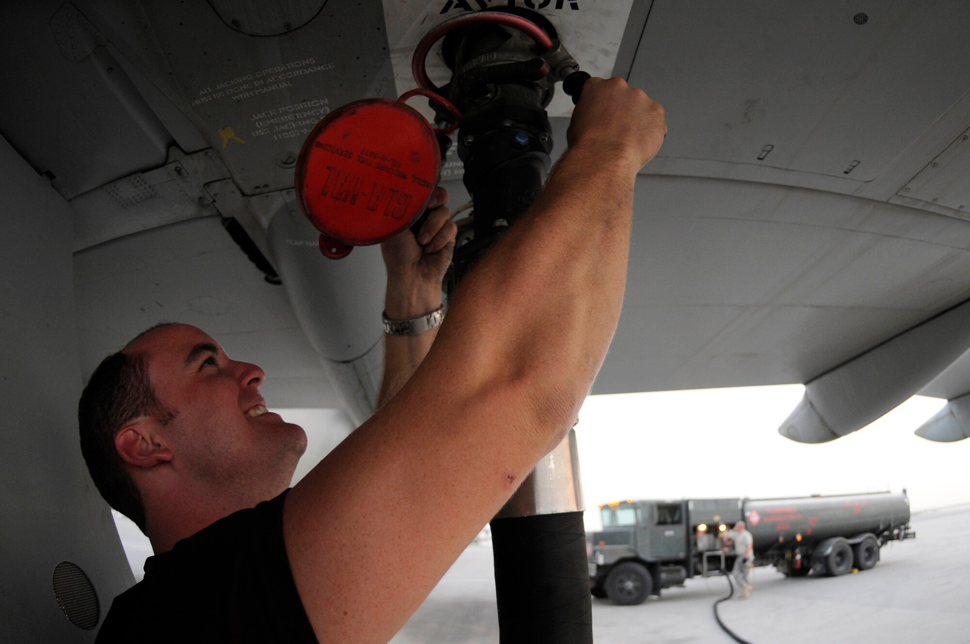 Senior Air Craftsman Martin Atkinson, propulsion technician assigned to the 101 Squadron, attaches a fueling hose to a VC-10 while Airman 1st Class Ron Turner, assigned to the 379th Expeditionary Logistics Readiness Squadron, stands by to begin fueling, Sept. 26, 2008, at an undisclosed air base in Southwest Asia. The VC-10 is a dual-role air transport and air-to-air refueling aircraft capable of dispensing to two receiver aircraft simultaneously from two under wing probe-and-drogue pods. VC-10s assigned here refuel British and other coalition aircraft supporting Operations Iraqi and Enduring Freedom. Craftsman Atkinson, a native of Dorset, England, is deployed from Royal Air Force Brize Norton, England, and Airman Turner, a native of Manteca, Calif., is deployed from Langley Air Force Base, Va. (U.S. Air Force photo by Staff Sgt. Darnell T. Cannady/Released)